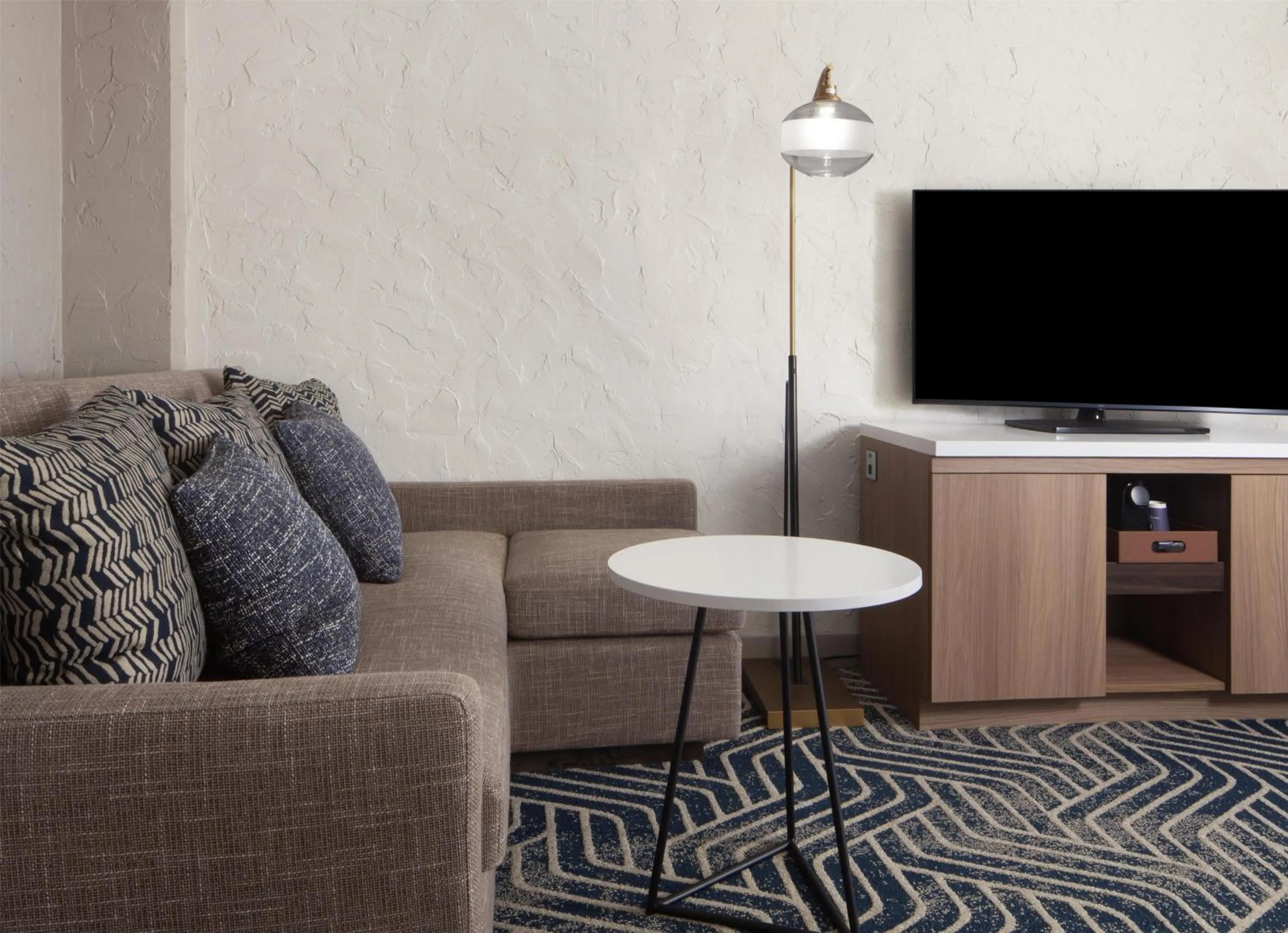 Living room in Hotel Royer Urbana Champaign, Tapestry Collection by Hilton