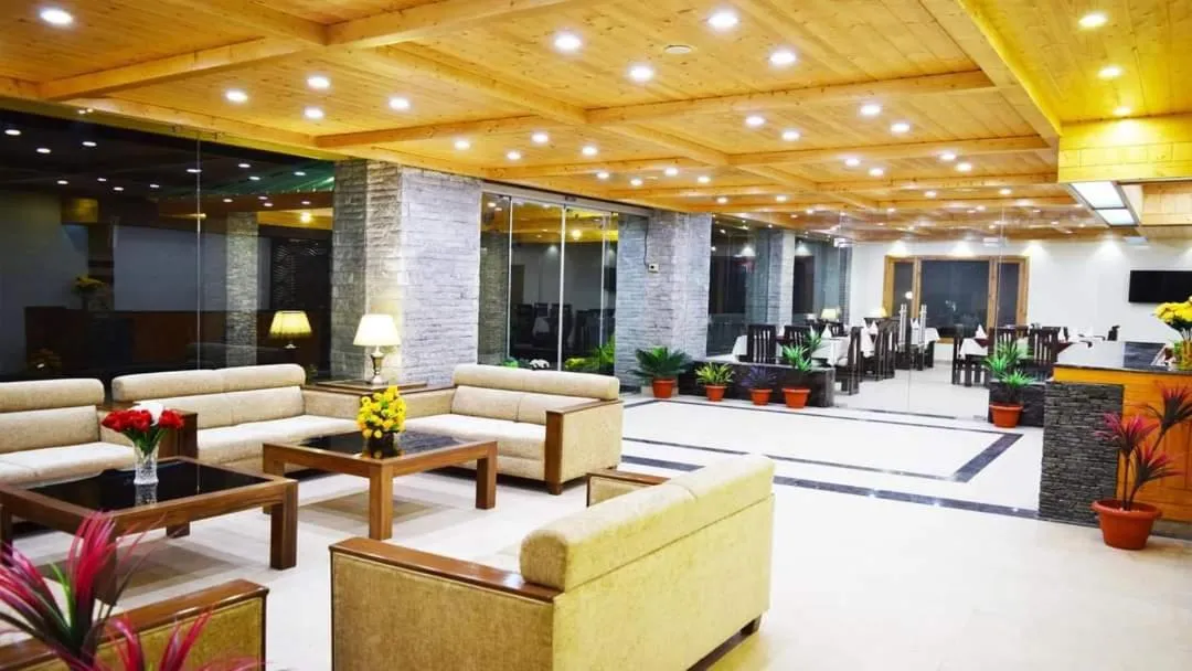 Communal lounge/ TV room in Azure Chandertal Regency Hotel And Spa