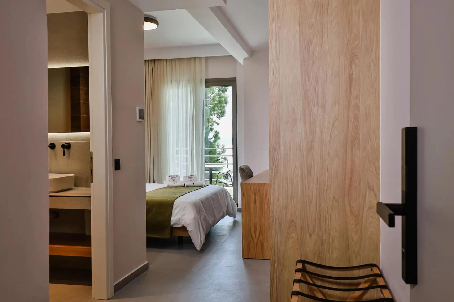 Photo of the whole room, Bed in LIMNI Boutique Experience Evia