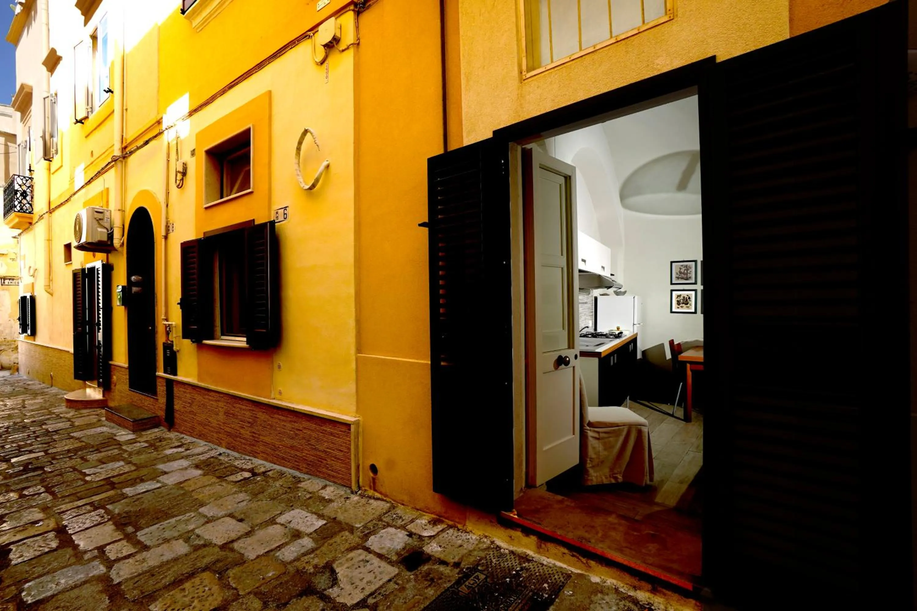 Property logo or sign in Elamar Rooms & Apartment