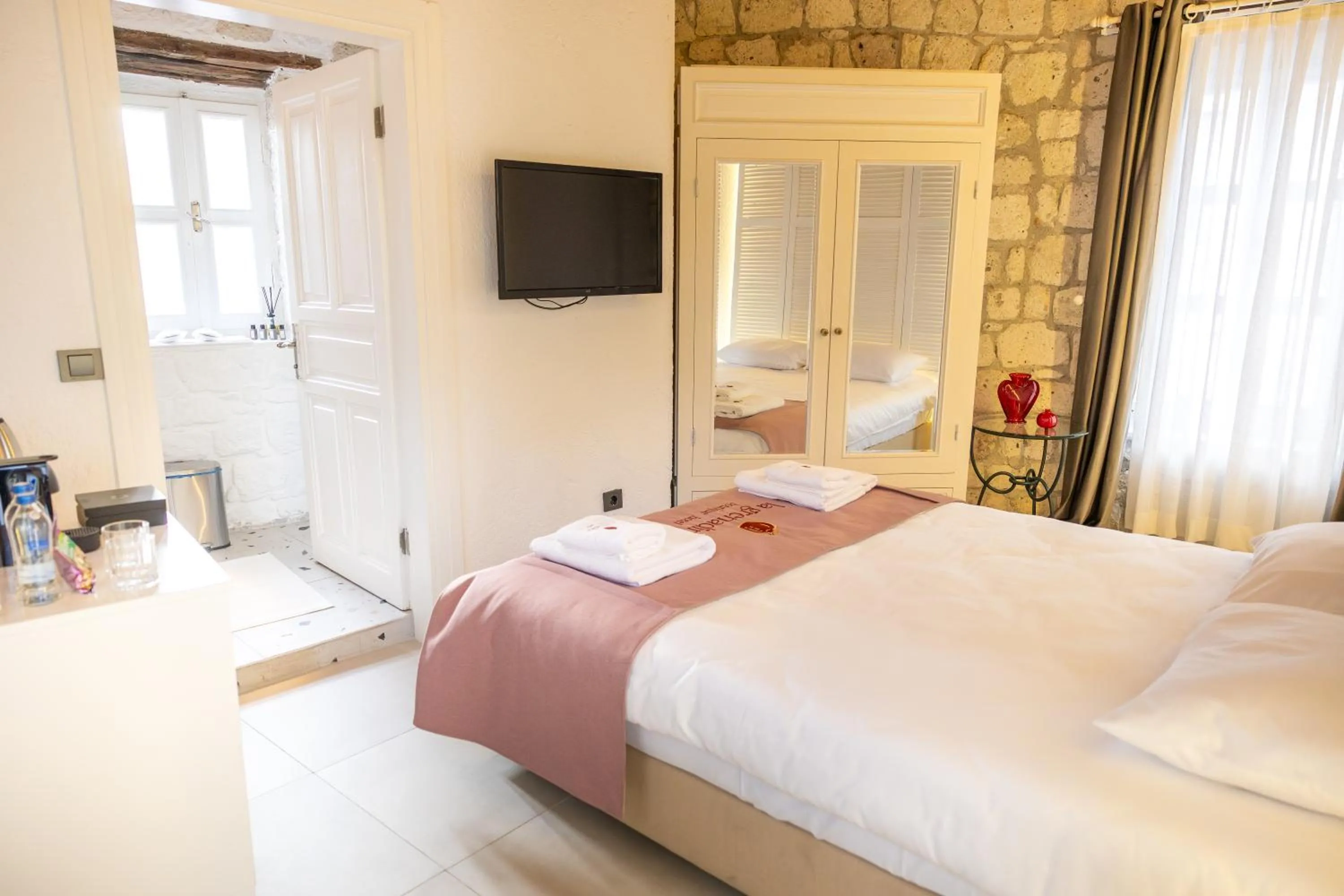Bed in La Grenadine Hotel