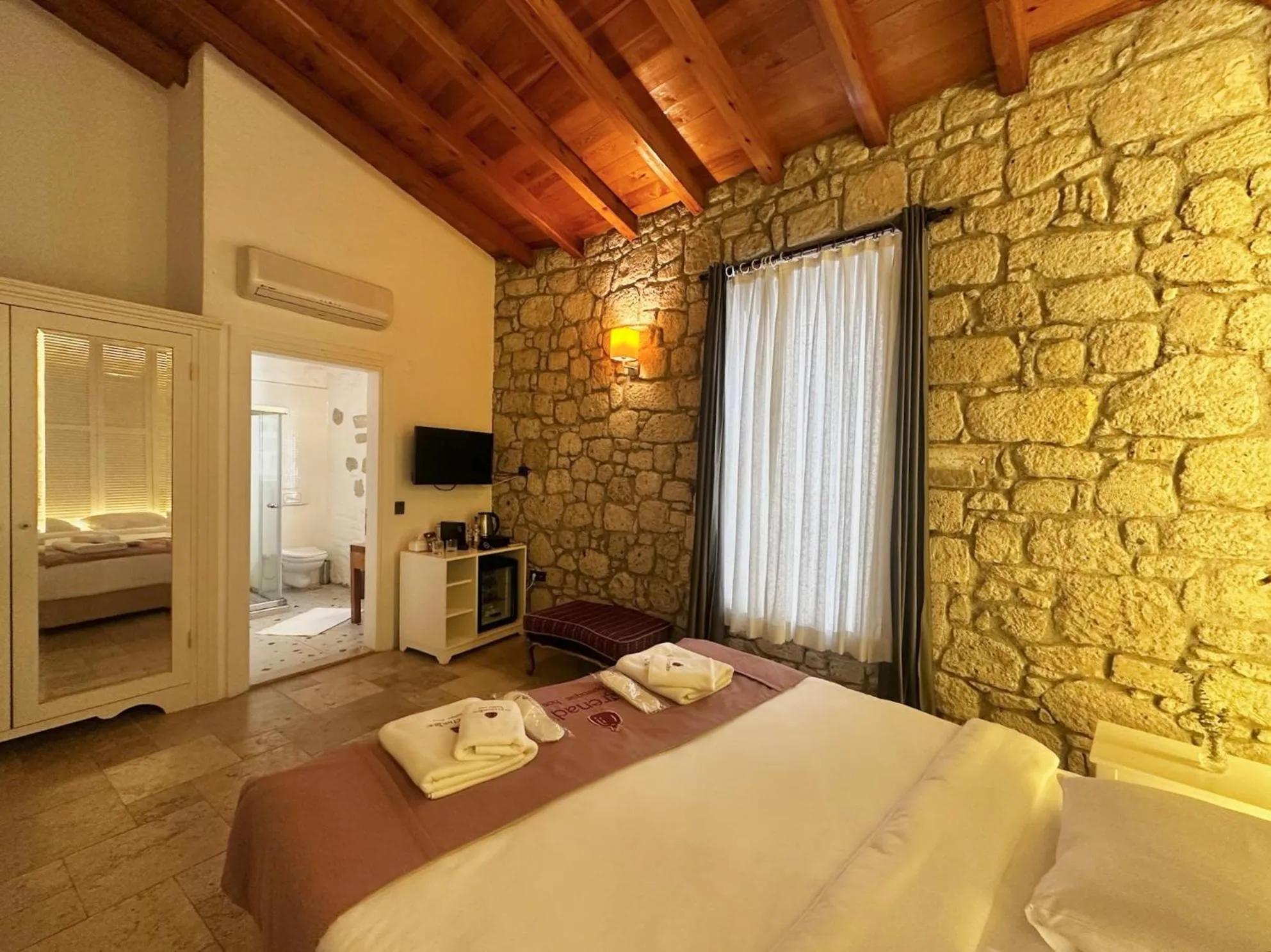 Bed in La Grenadine Hotel