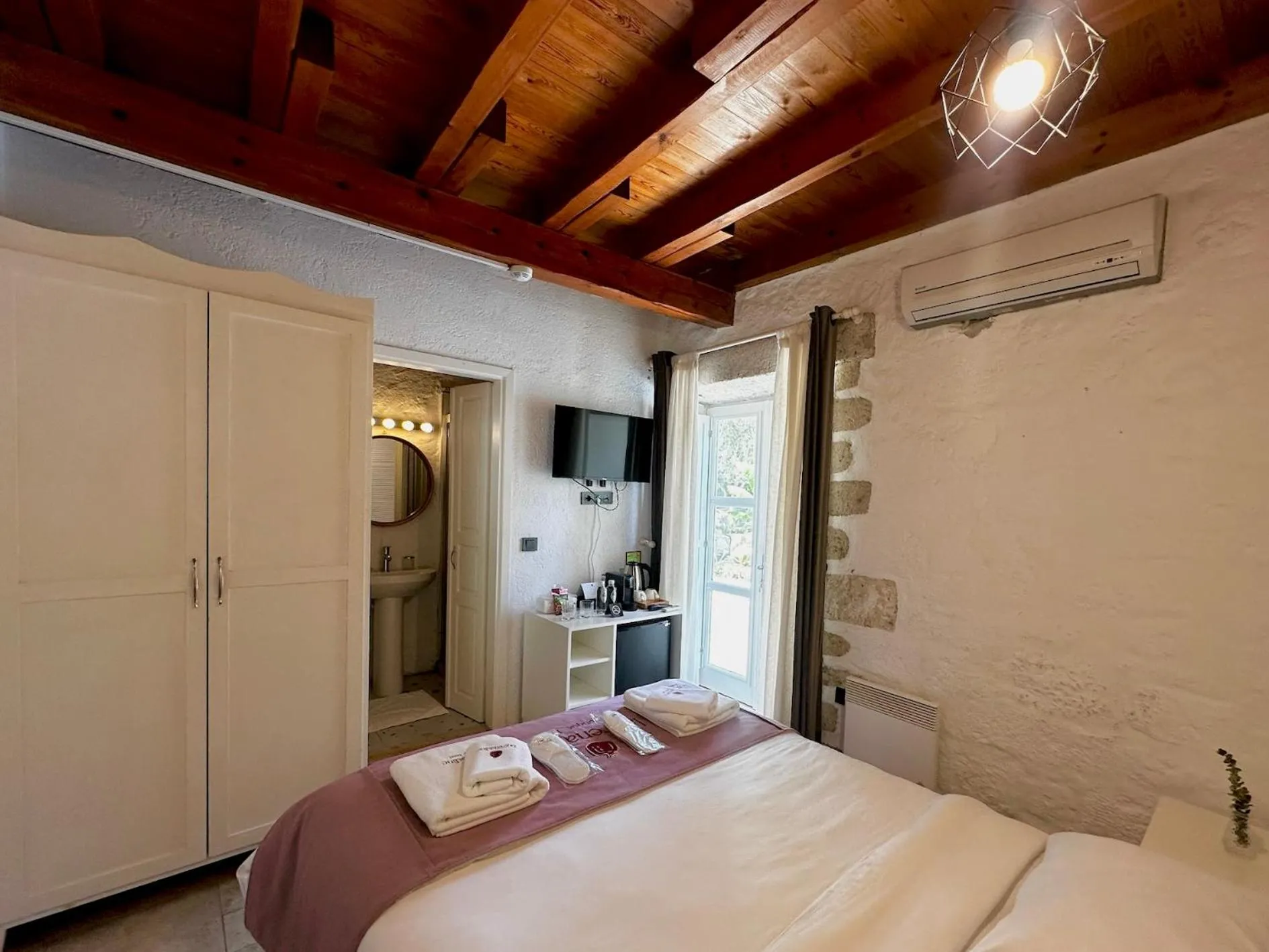 Bed in La Grenadine Hotel
