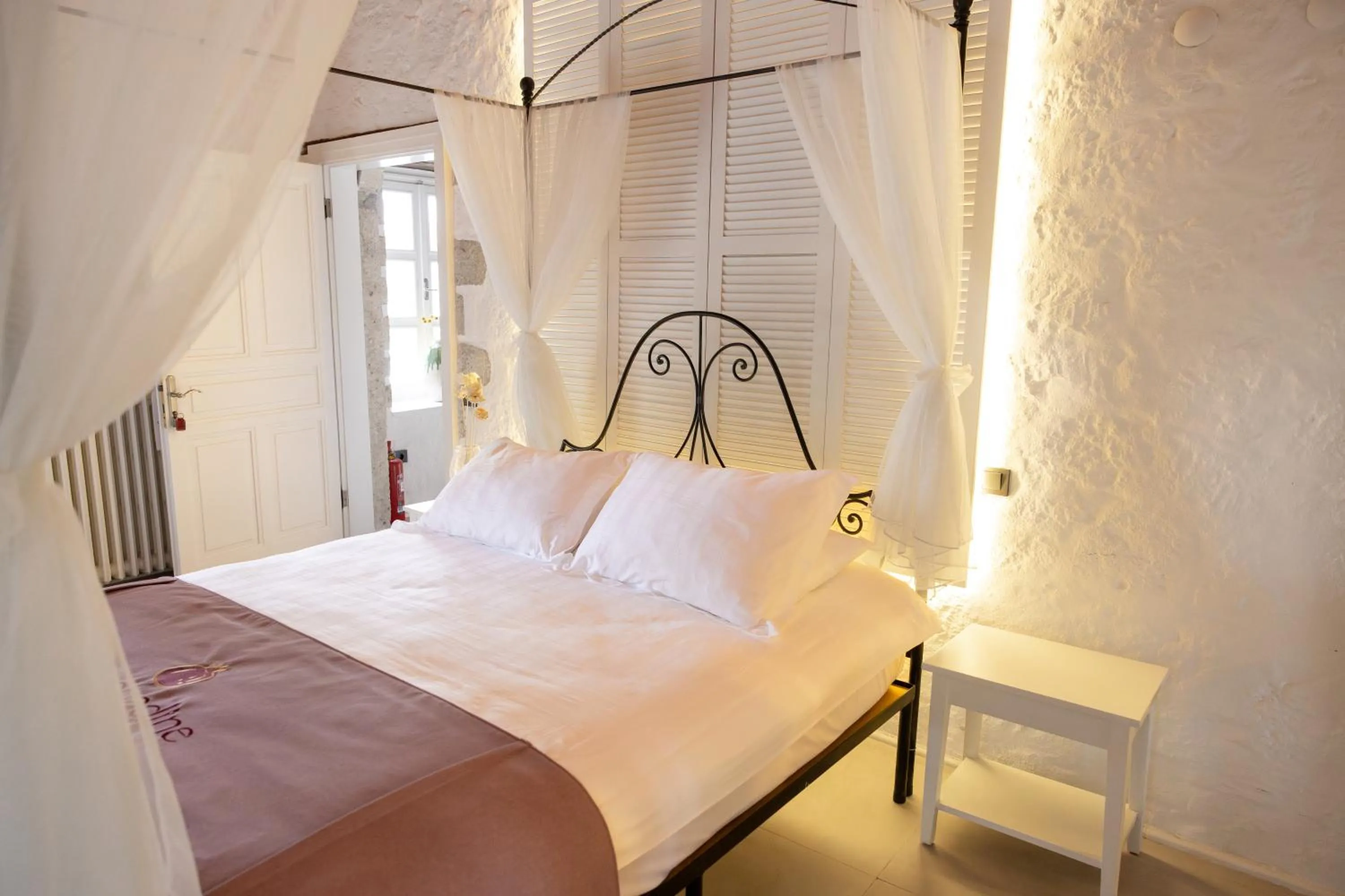Bed in La Grenadine Hotel
