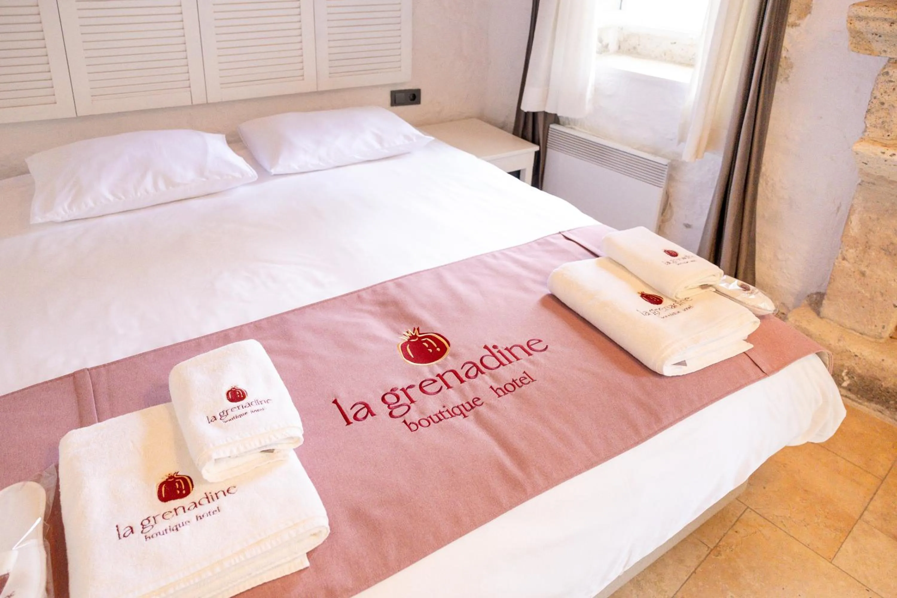 Bed in La Grenadine Hotel