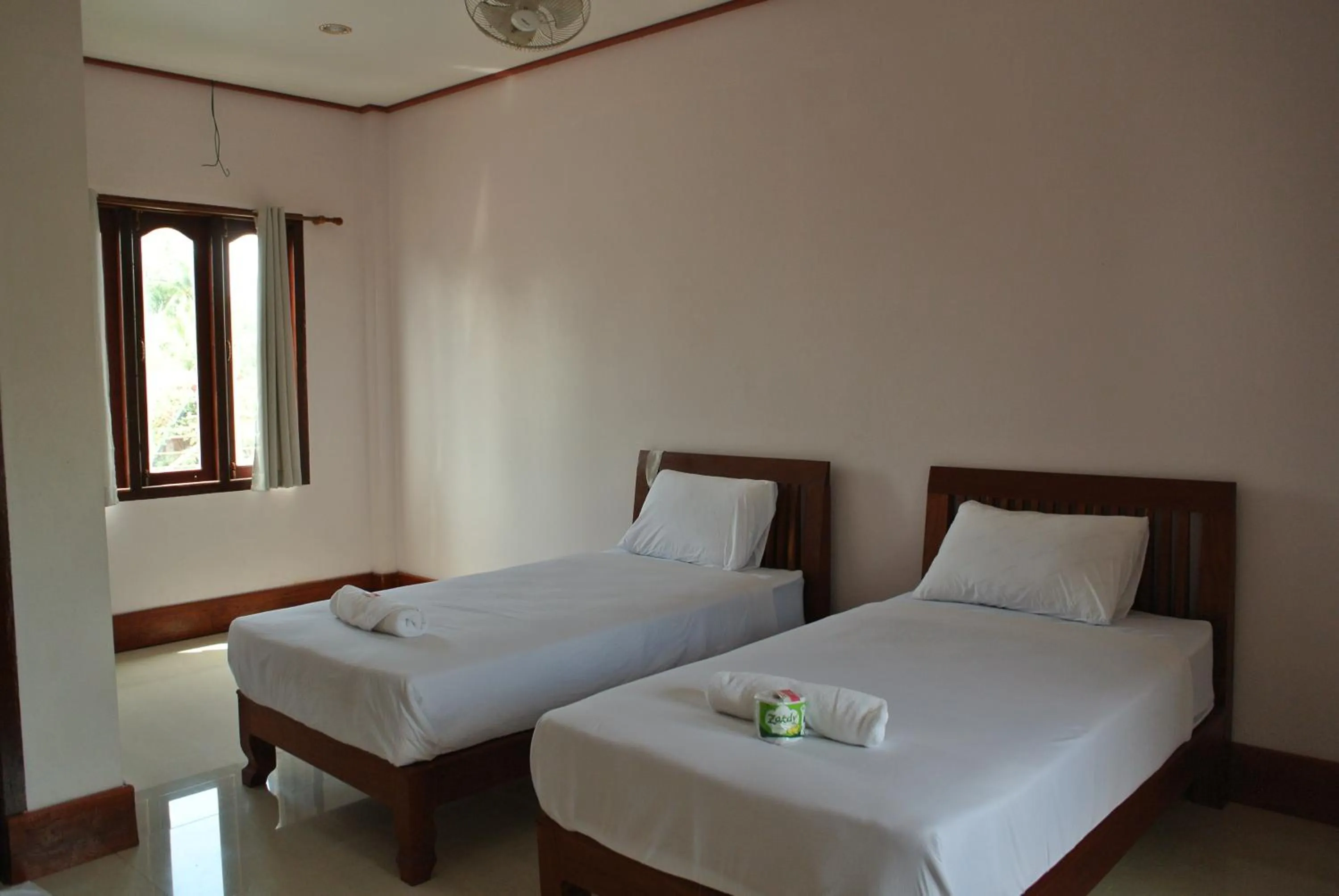 Bed in Mama Leurth Sunset Guesthouse