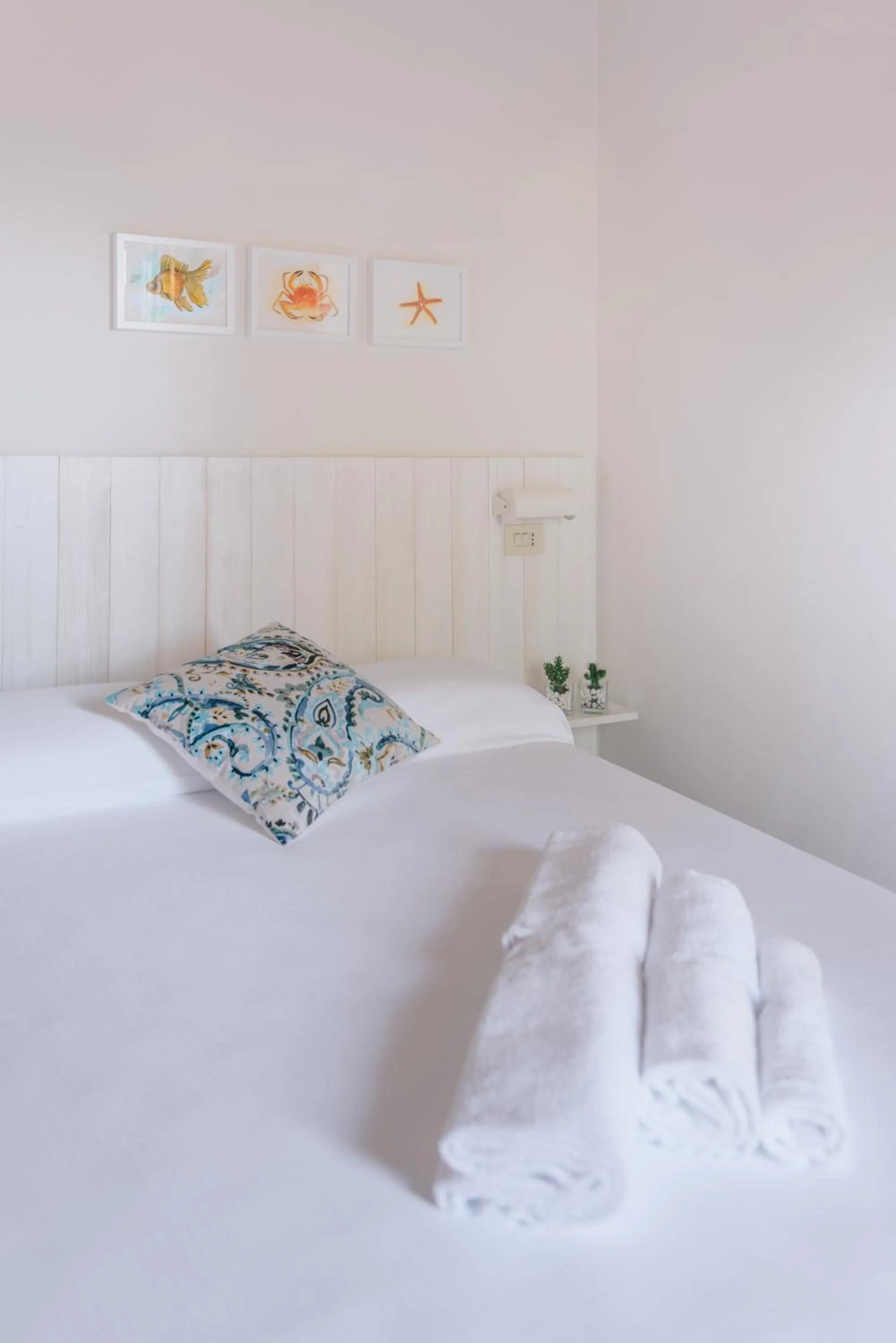 Bed in Mami Sabaudia Hotel