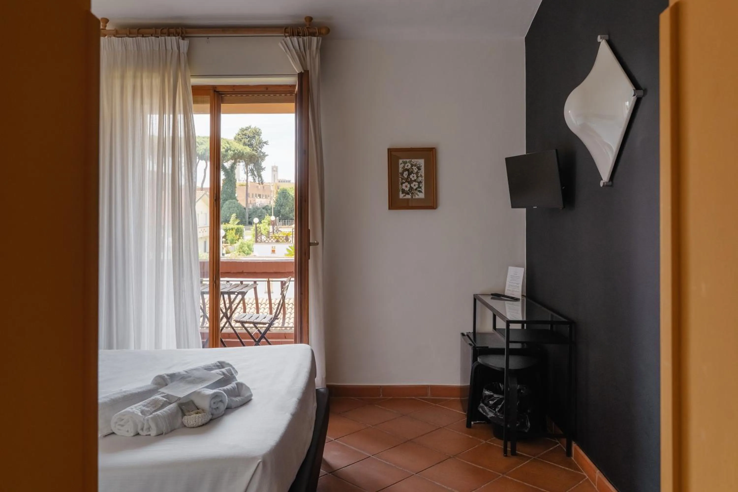 Bed in Mami Sabaudia Hotel