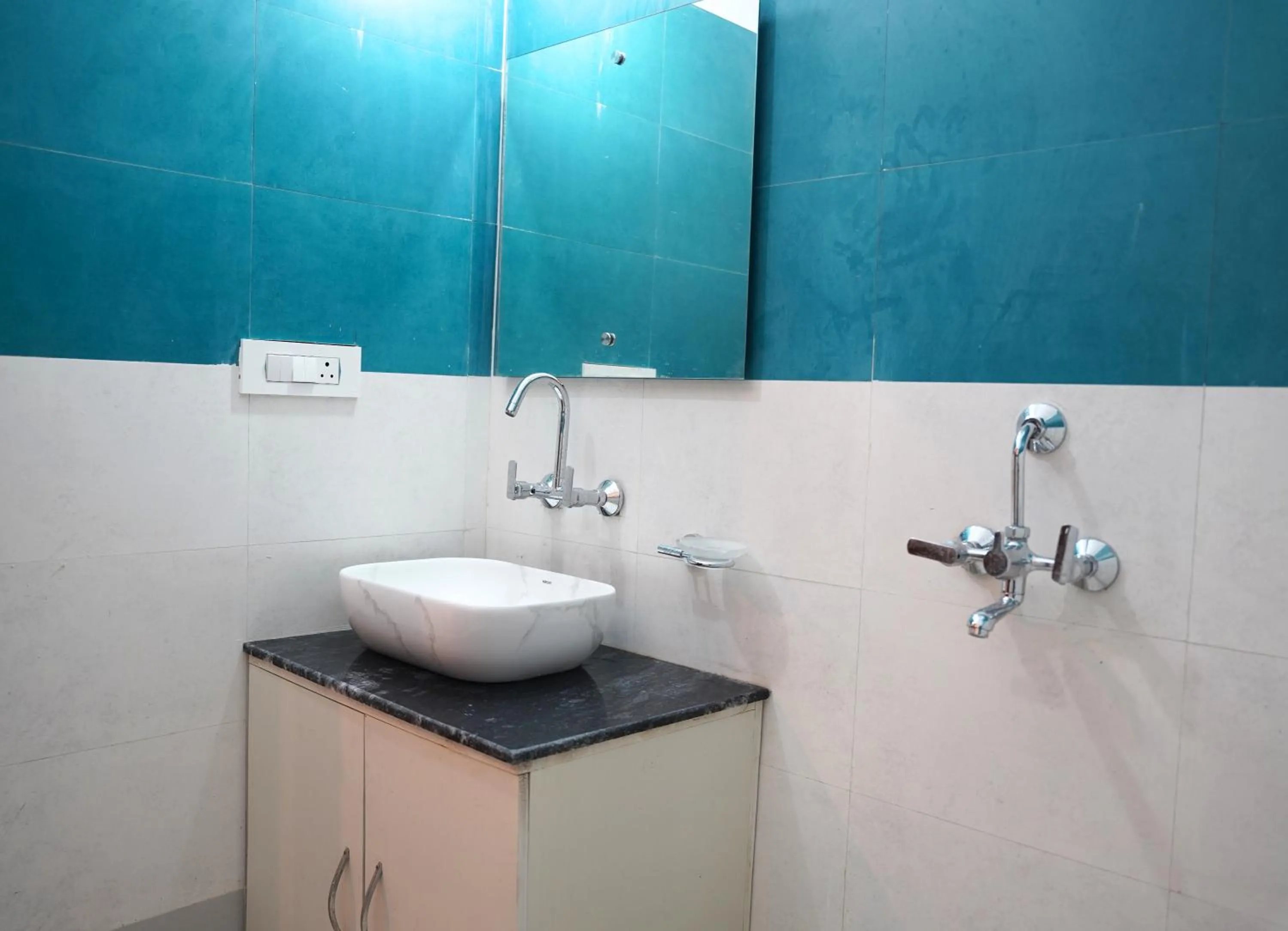 Bathroom in Hotel HSR Residency
