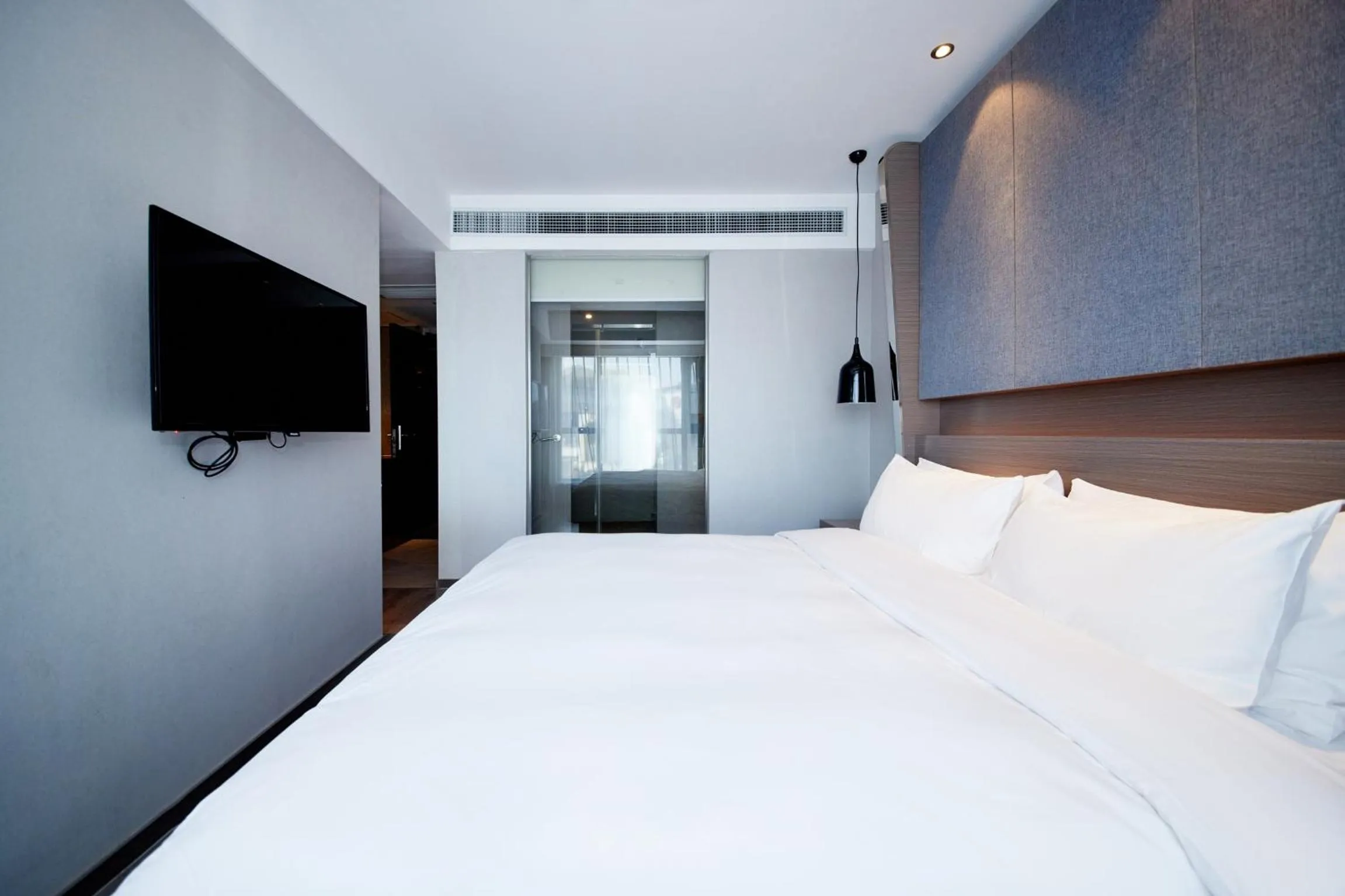Bedroom, Bed in Orange Hotel Shanghai Hongkou Football Stadium Branch