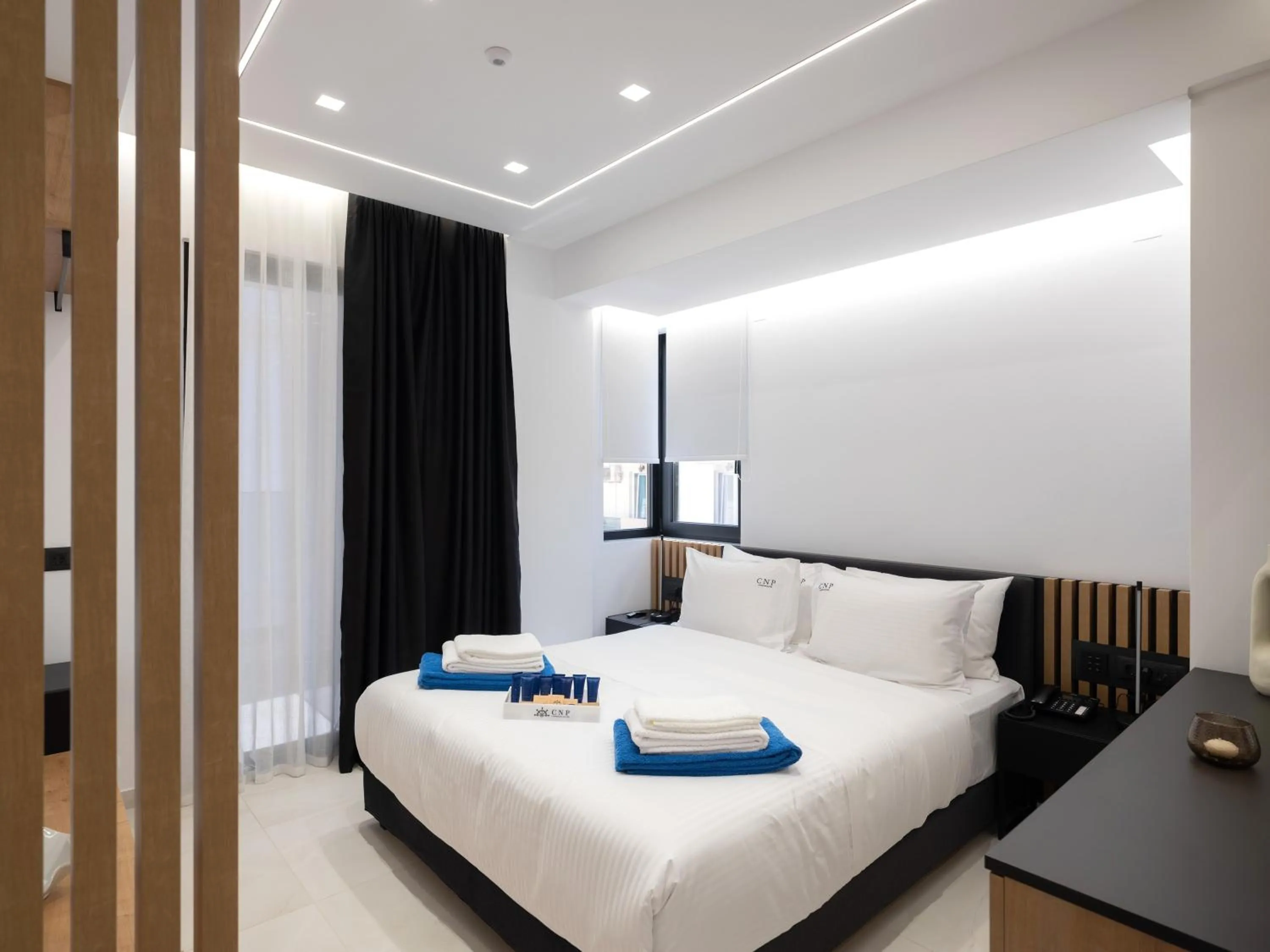 Bed in Captain Napoleon Paterakis CNP Luxurious Suites