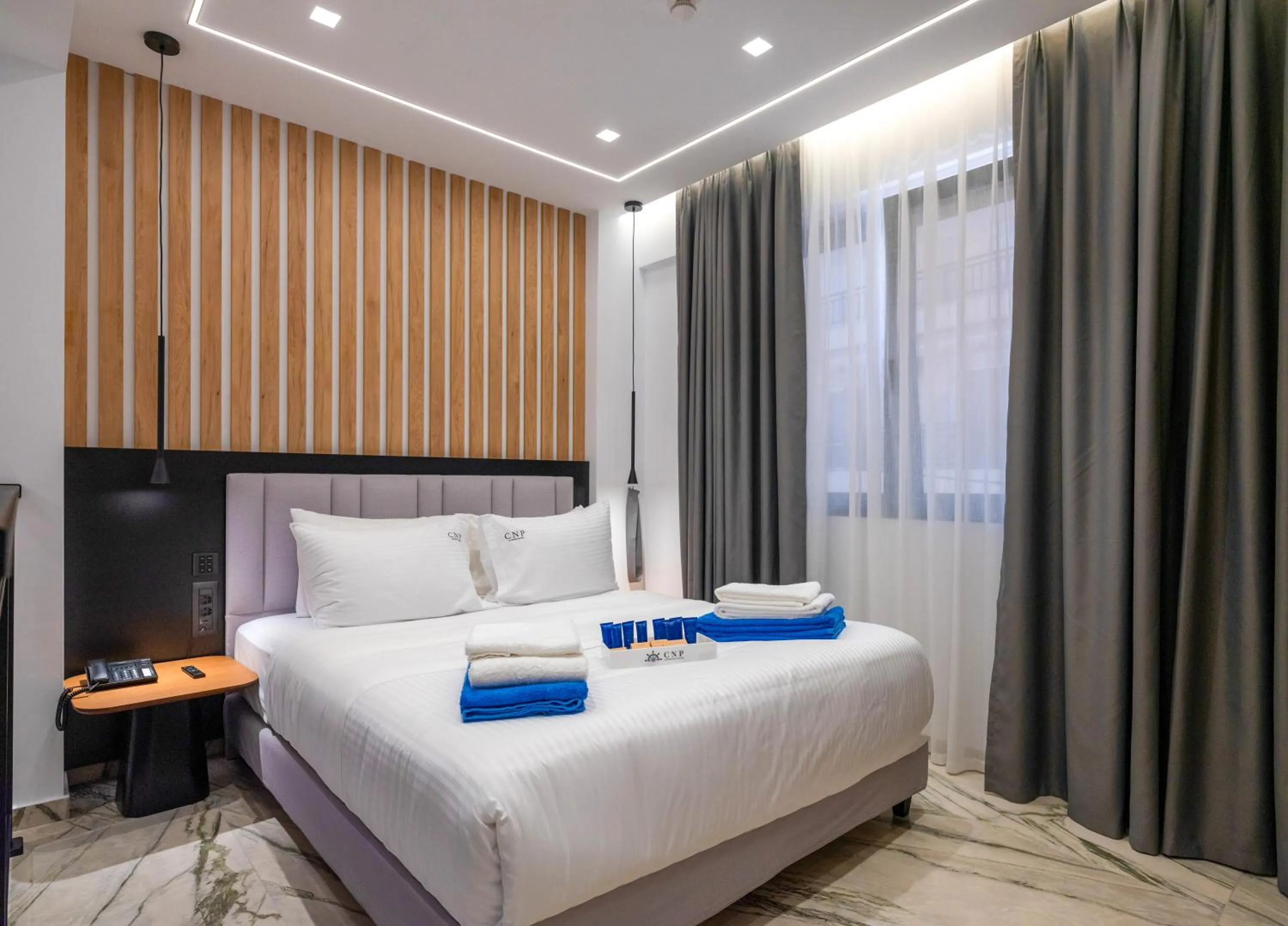 Bed in Captain Napoleon Paterakis CNP Luxurious Suites