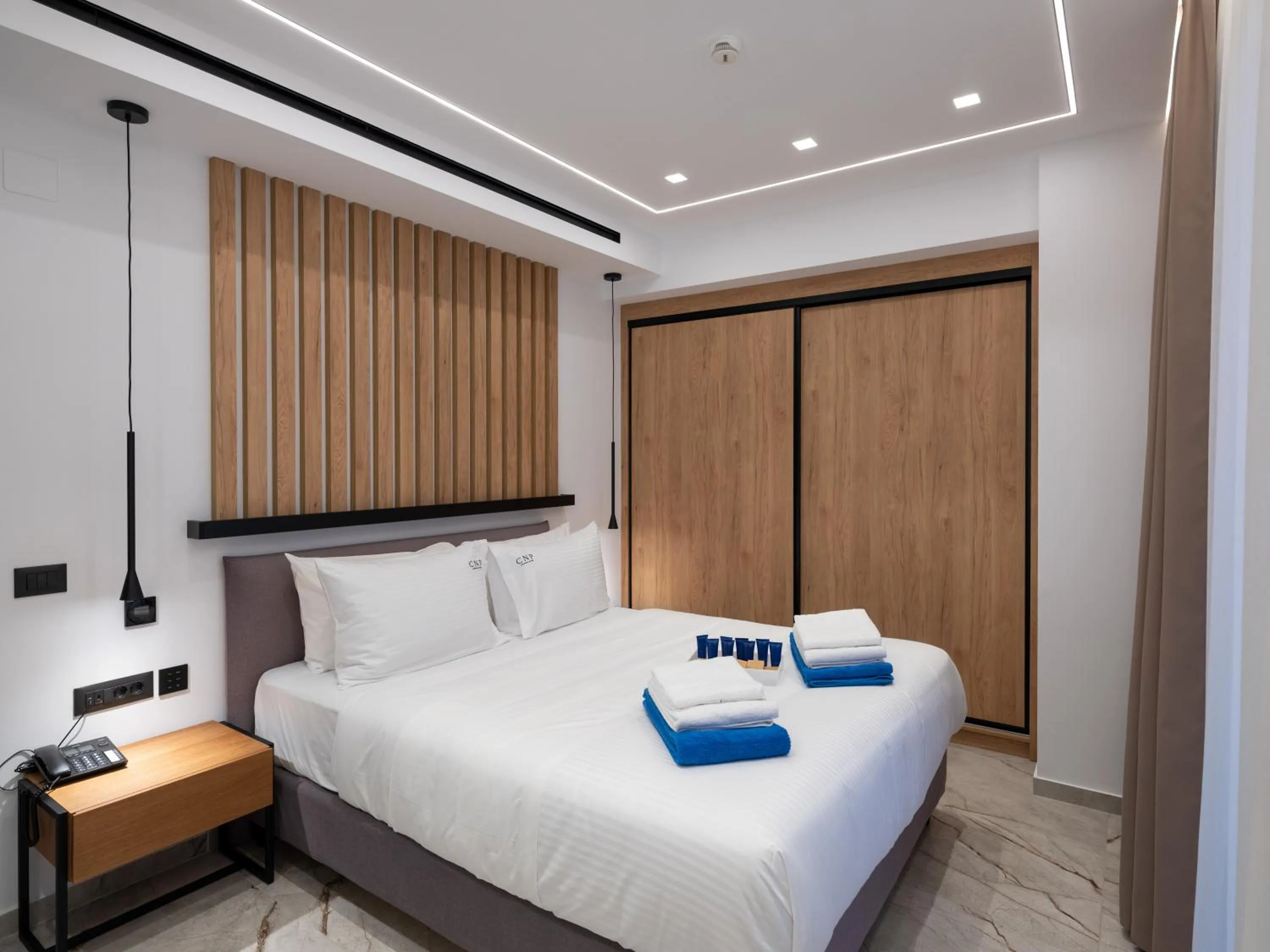 Bed in Captain Napoleon Paterakis CNP Luxurious Suites