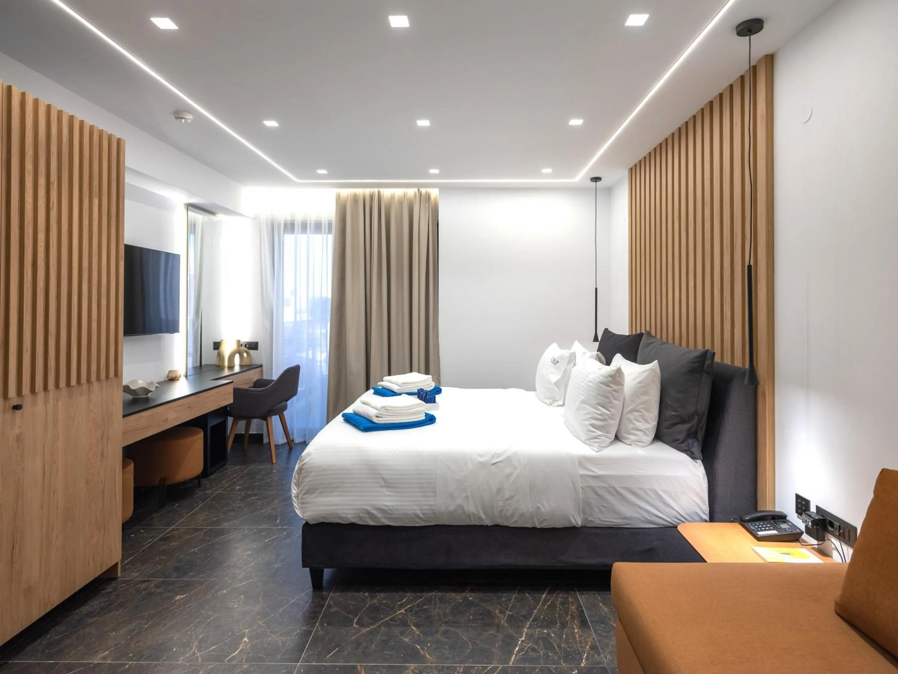 Bed in Captain Napoleon Paterakis CNP Luxurious Suites