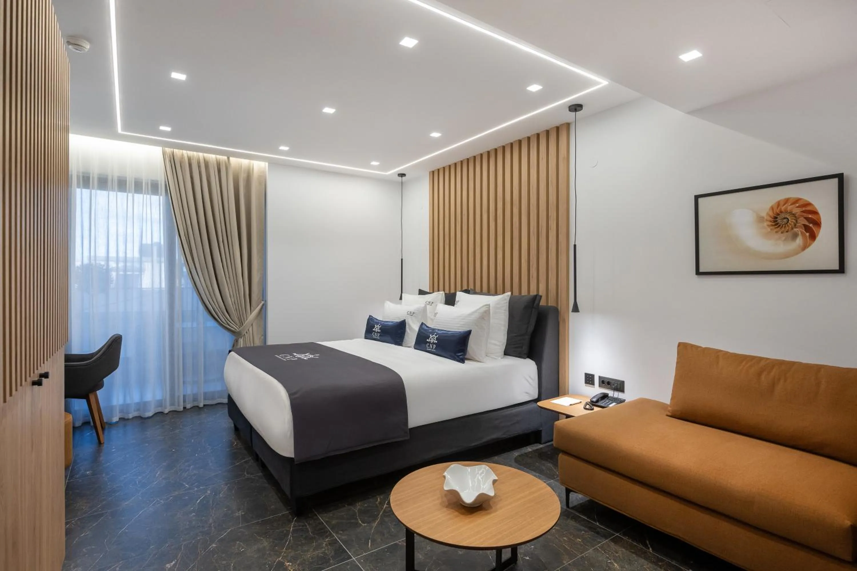 Bed in Captain Napoleon Paterakis CNP Luxurious Suites