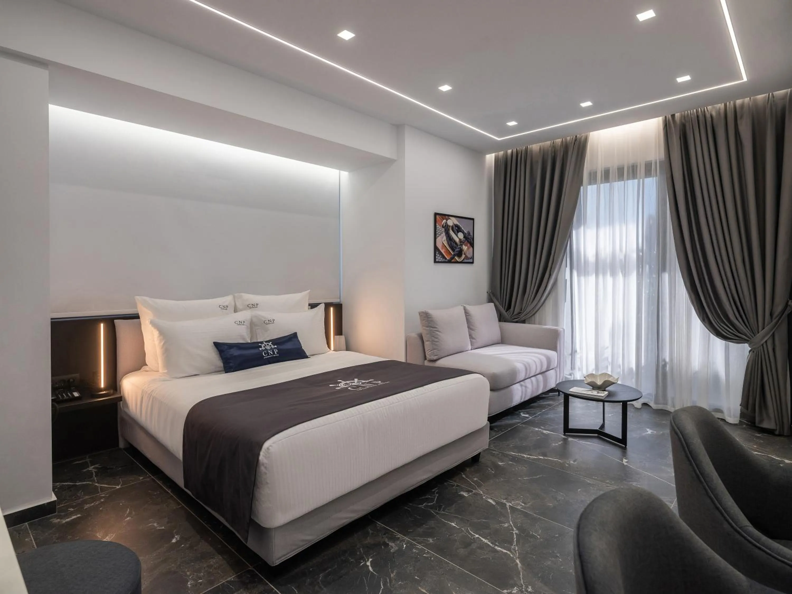 Bed in Captain Napoleon Paterakis CNP Luxurious Suites