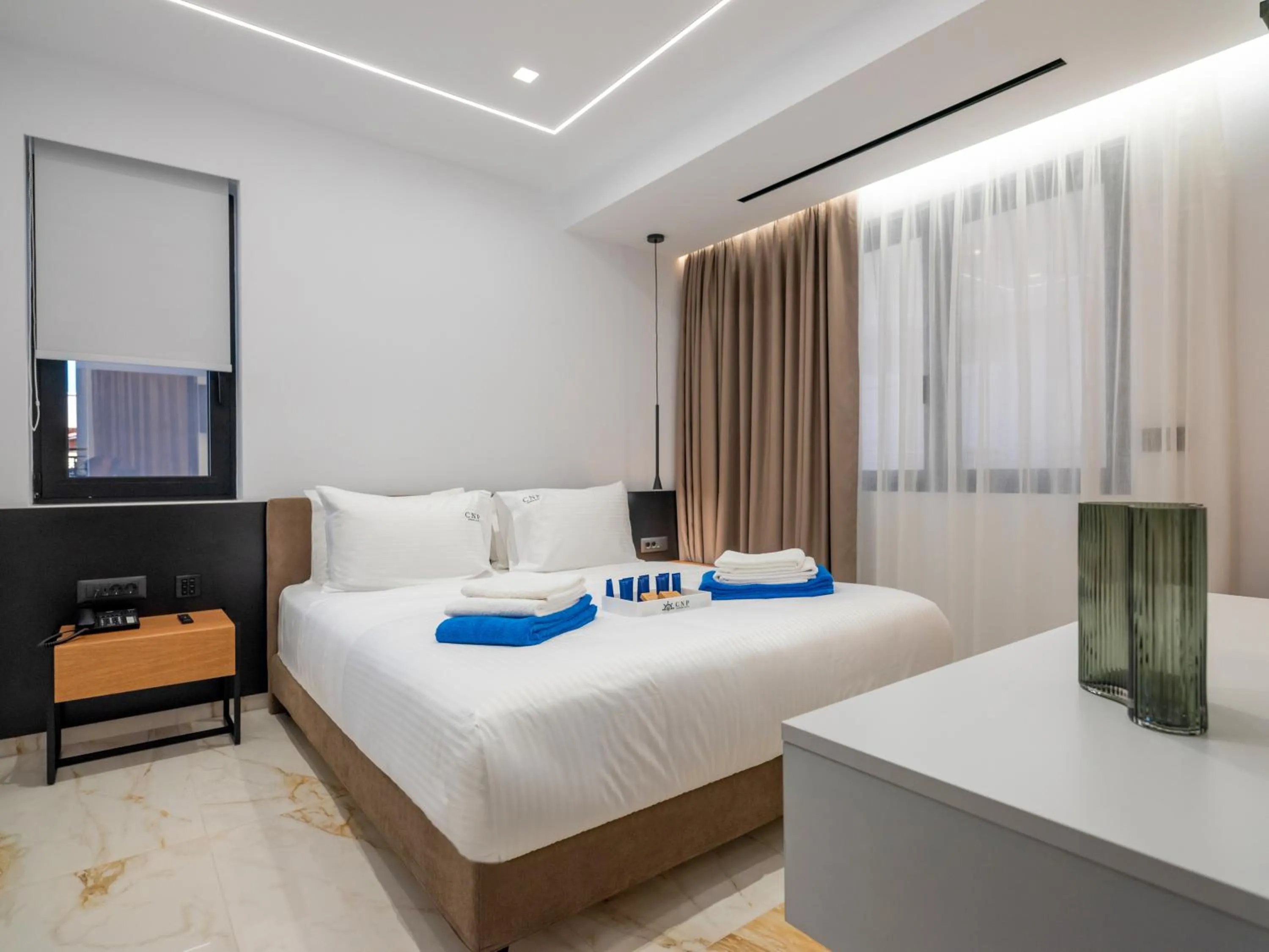 Bed in Captain Napoleon Paterakis CNP Luxurious Suites