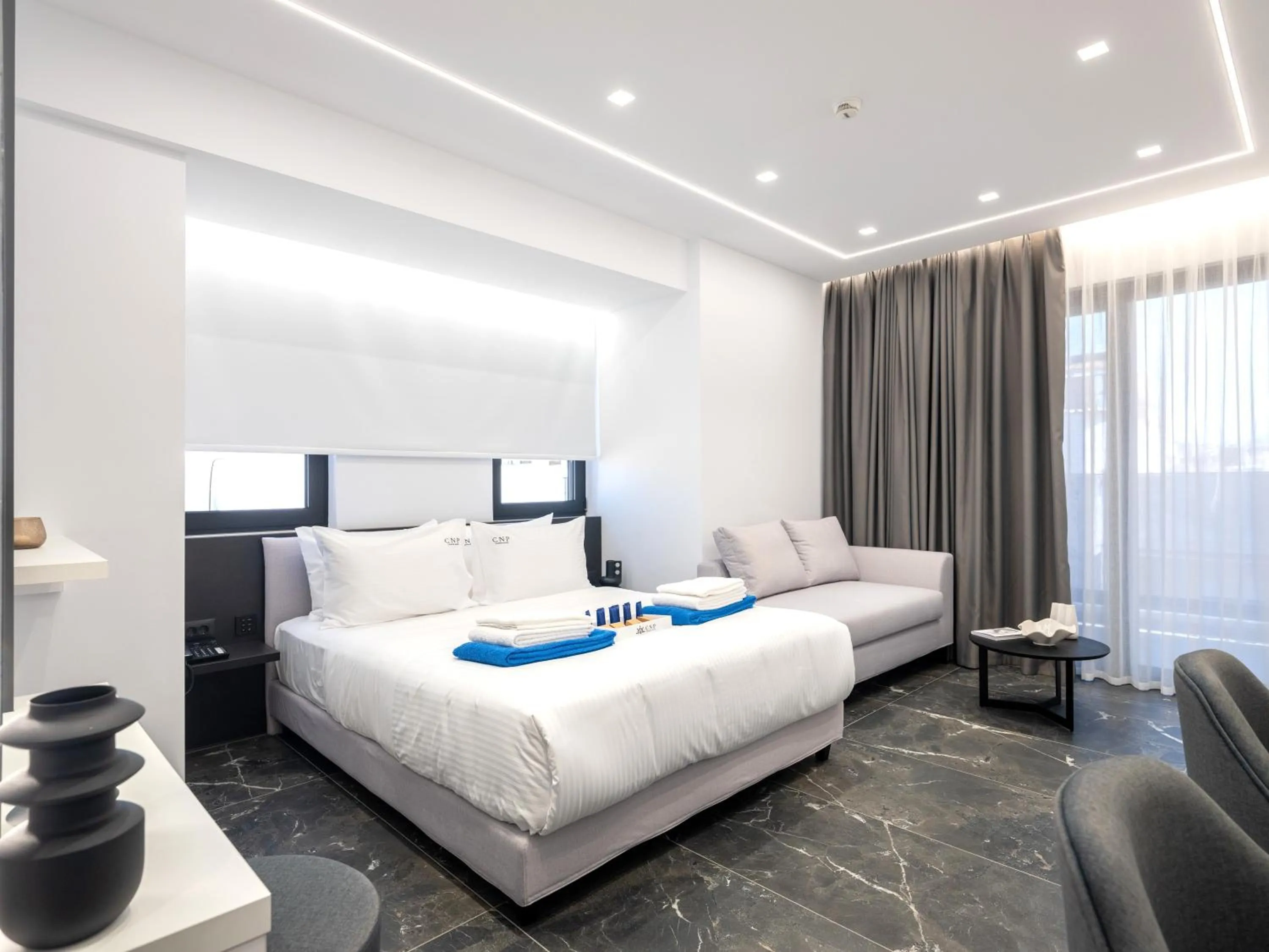 Bed in Captain Napoleon Paterakis CNP Luxurious Suites