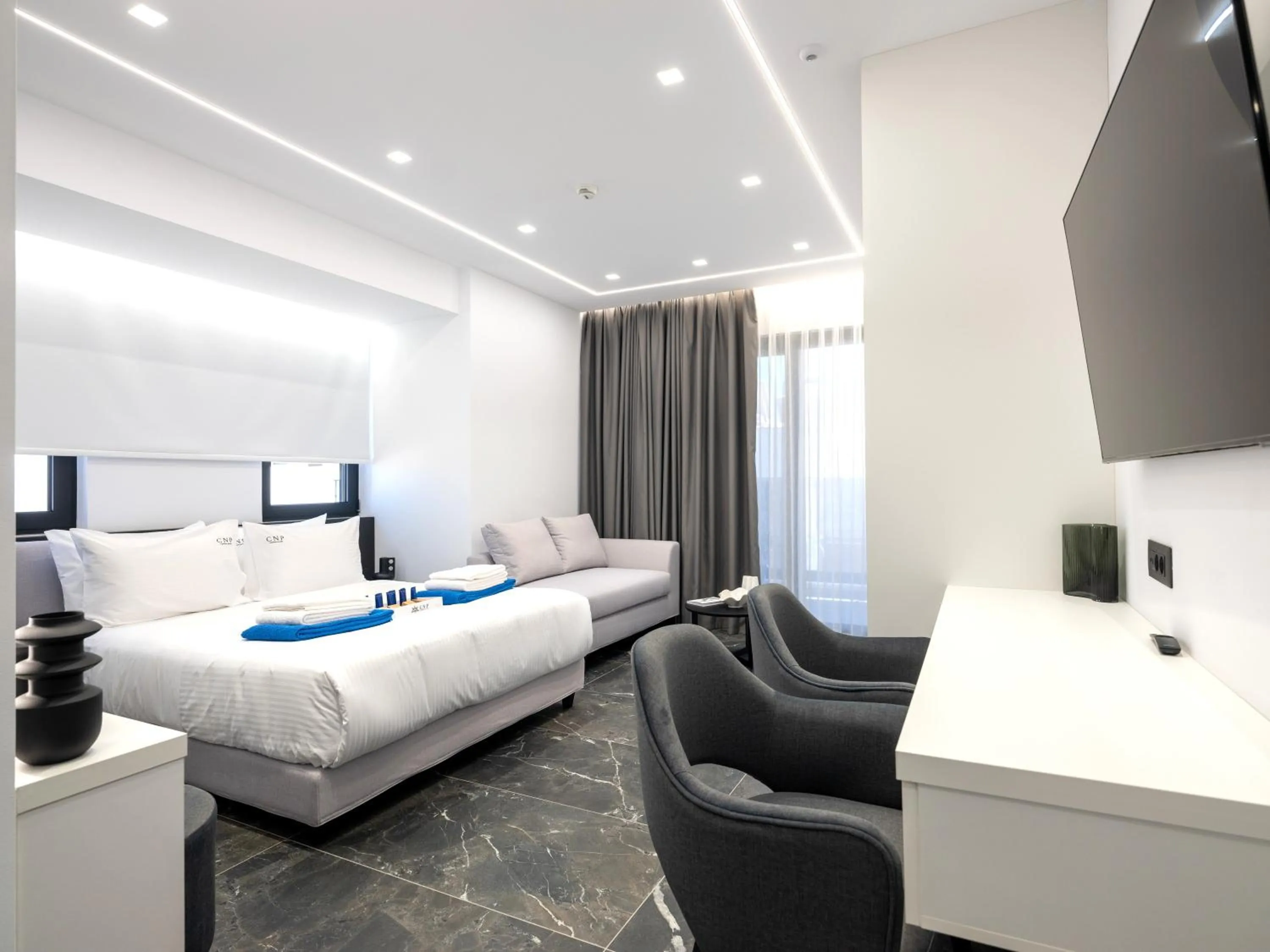 Bed in Captain Napoleon Paterakis CNP Luxurious Suites