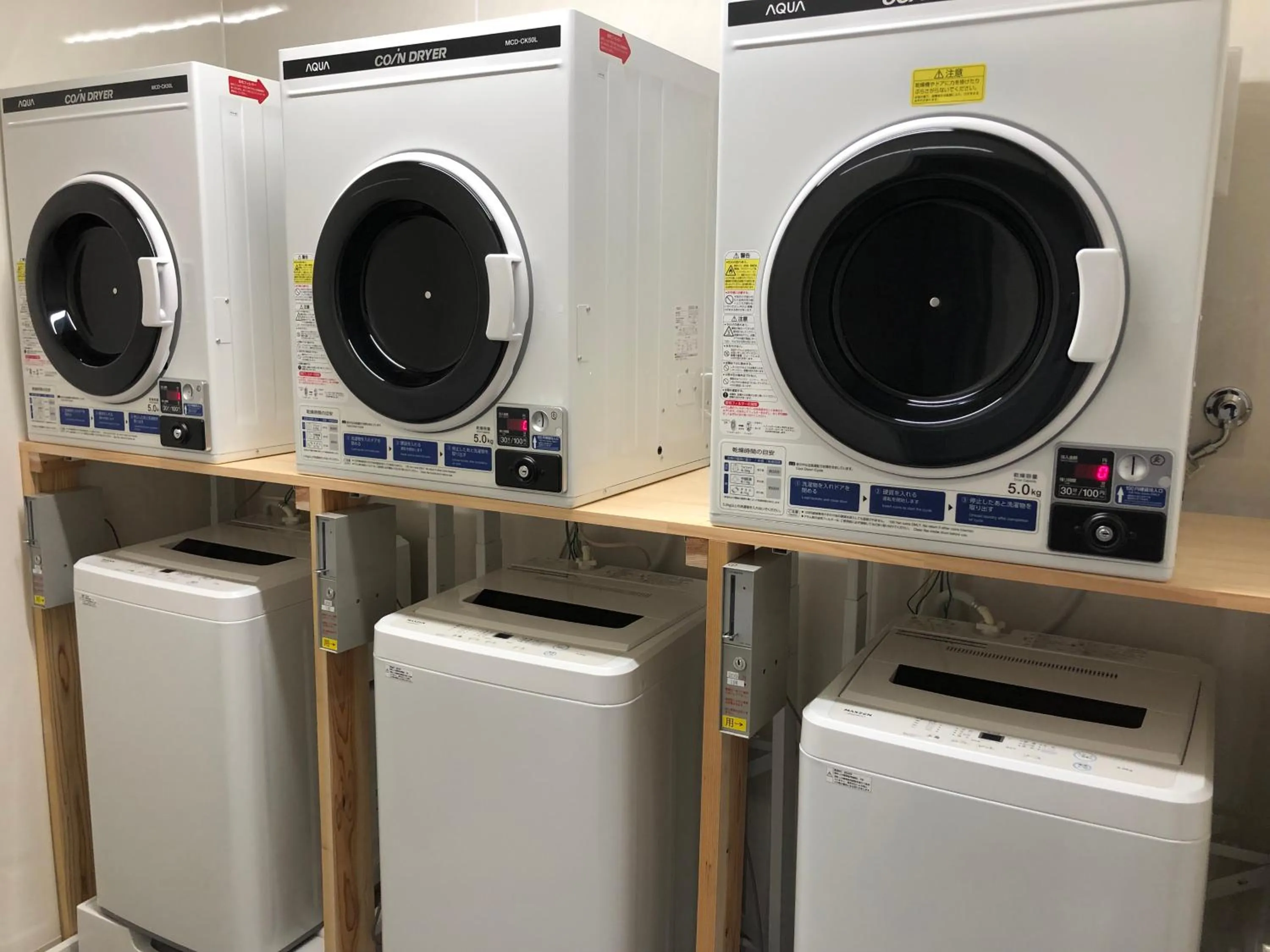 washing machine in Hotel Crown Hills GOI