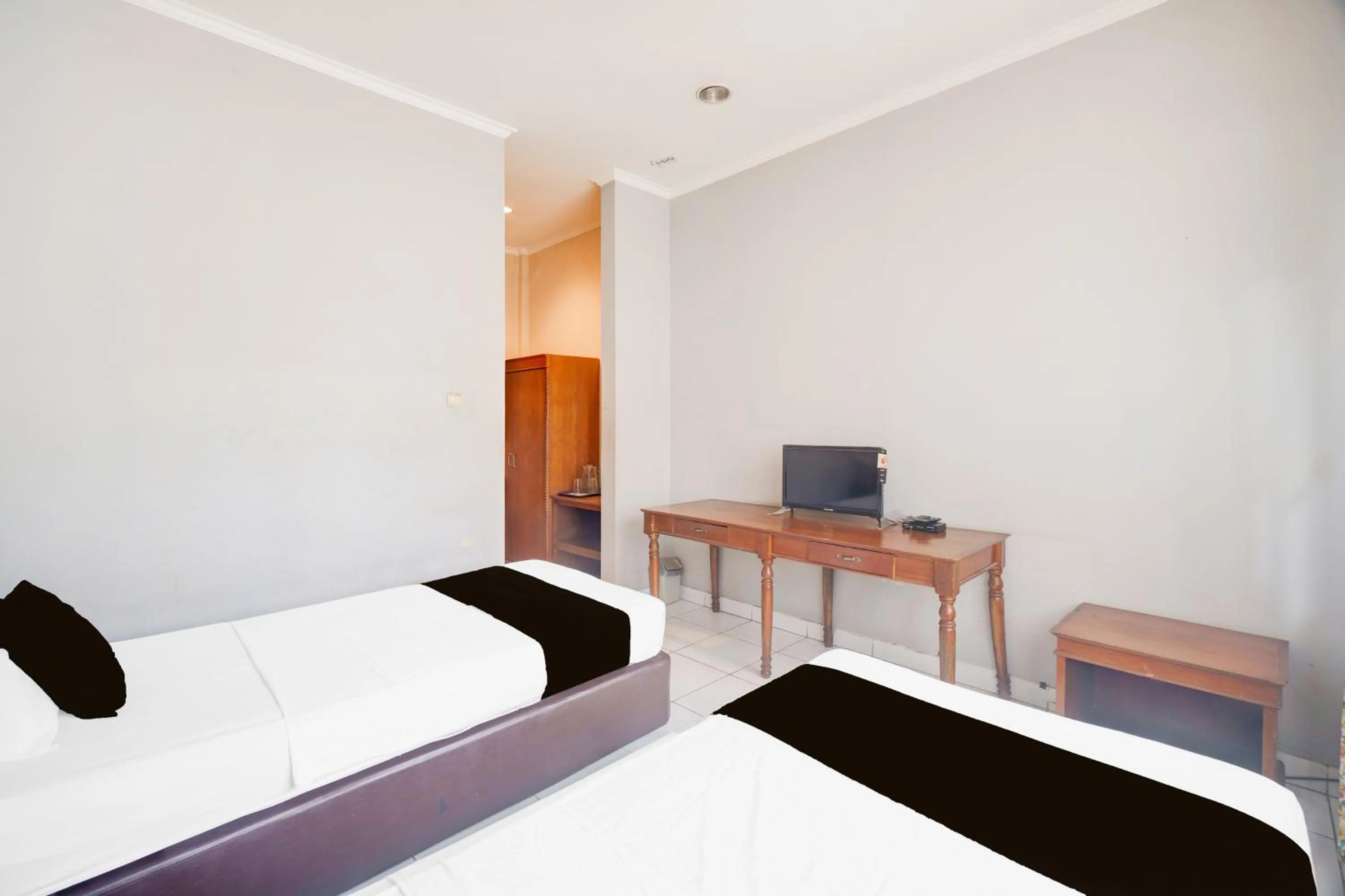 Photo of the whole room, Bed in Hotel O Bogor near Taman Safari formerly Hotel Rudian 1