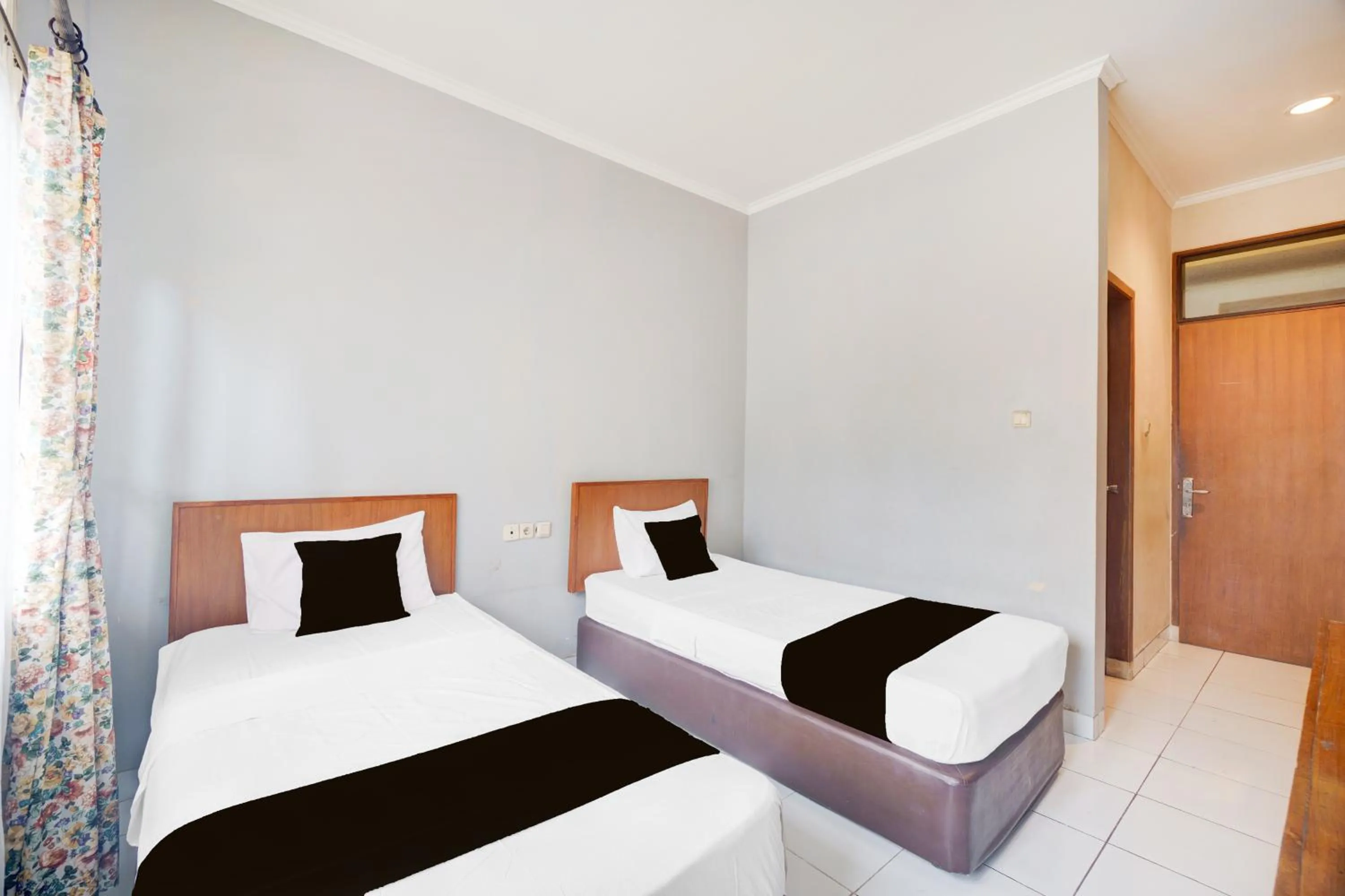 Photo of the whole room, Bed in Hotel O Bogor near Taman Safari formerly Hotel Rudian 1