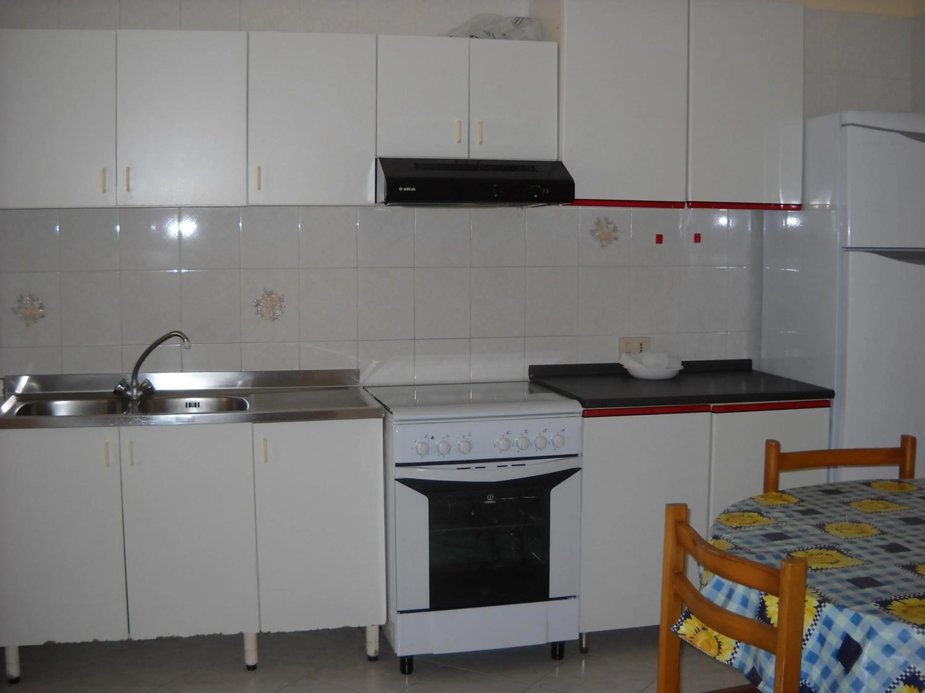 Kitchen or kitchenette in Stella di Mare Appartamenti