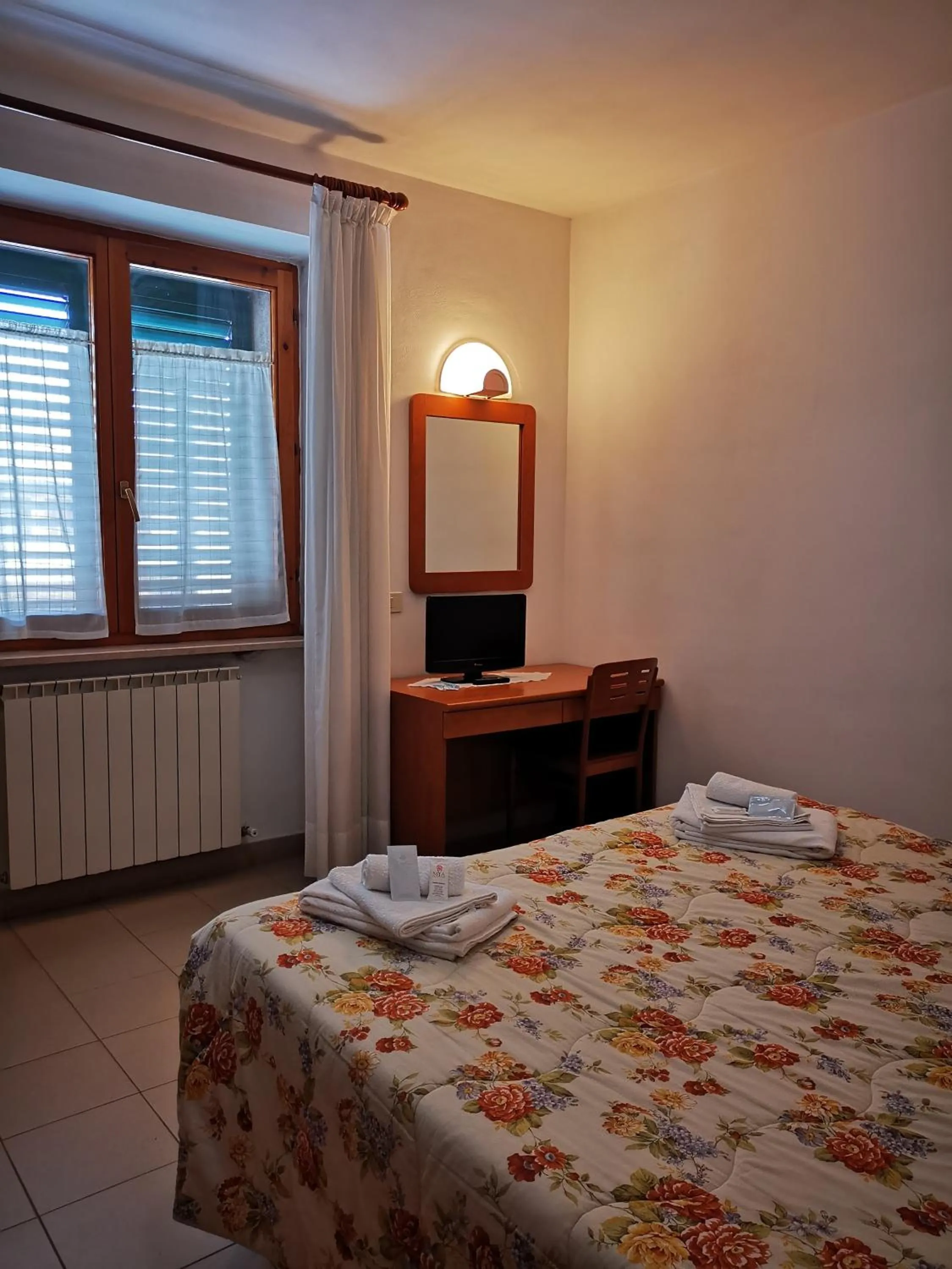 Bedroom in Osteria dei Locandieri