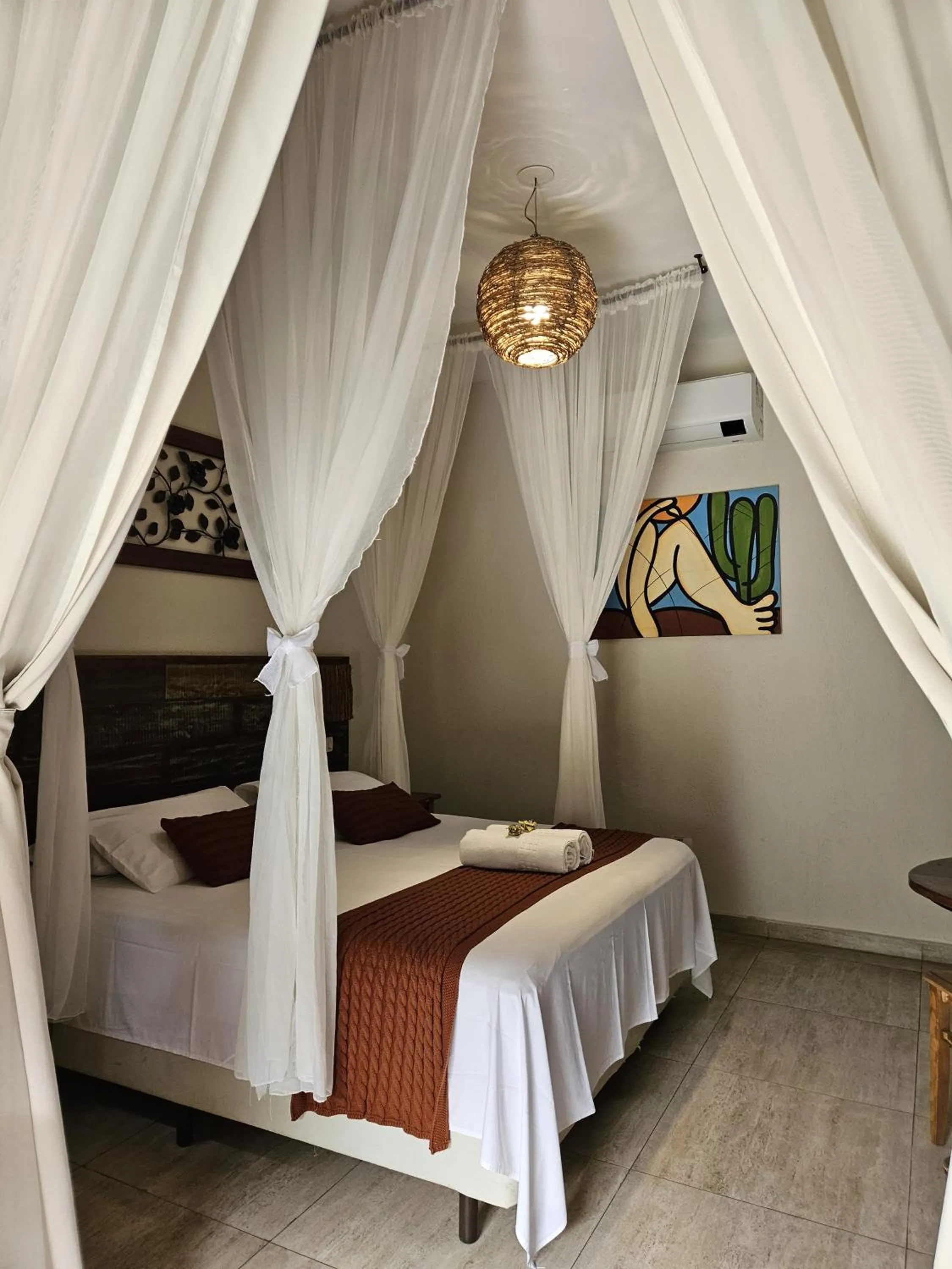 Bed in Pousada de Charme Emirados