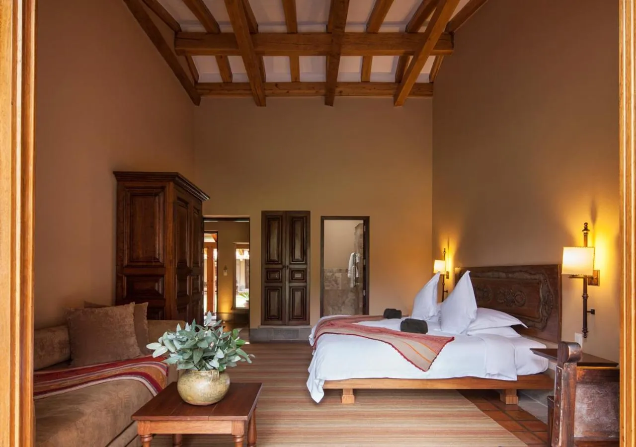 Photo of the whole room, Bed in Inkaterra Hacienda Urubamba