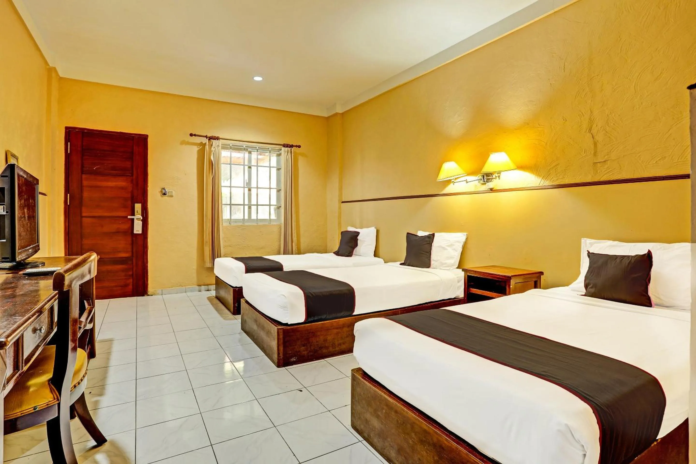 Bedroom in Collection O 91081 New Arena Hotel