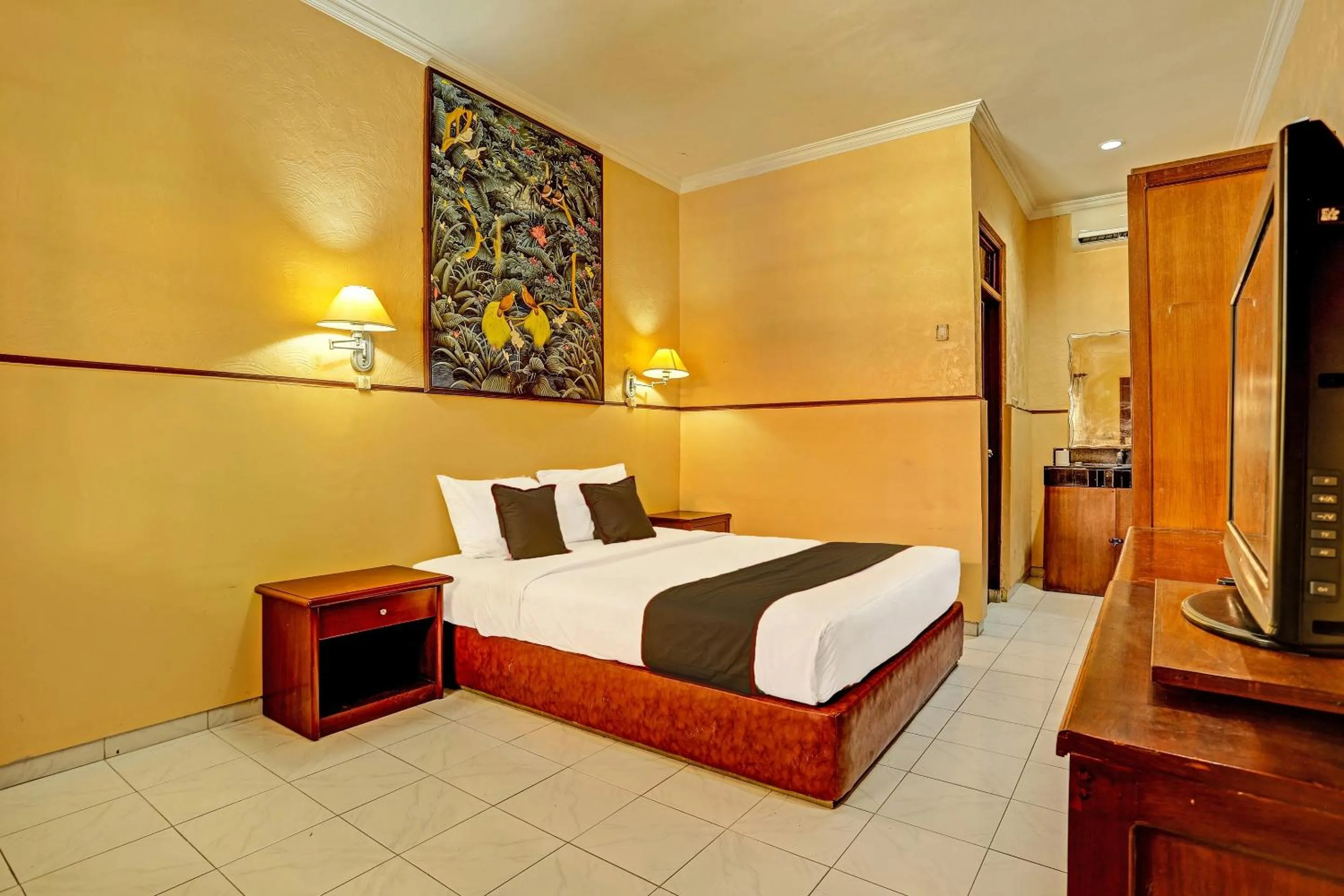 Bedroom in Collection O 91081 New Arena Hotel