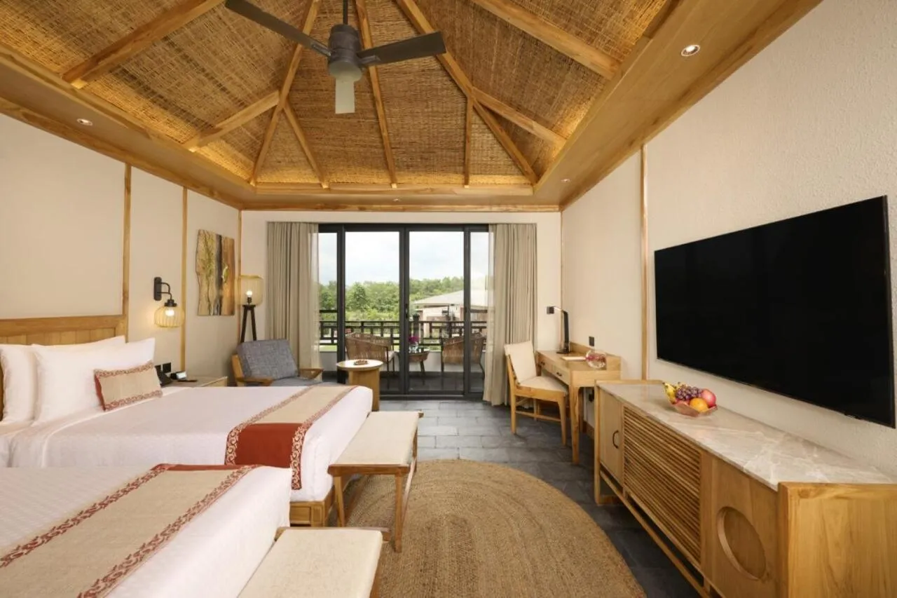 Bedroom, Bed in Royal Tulip Chitwan Nepal