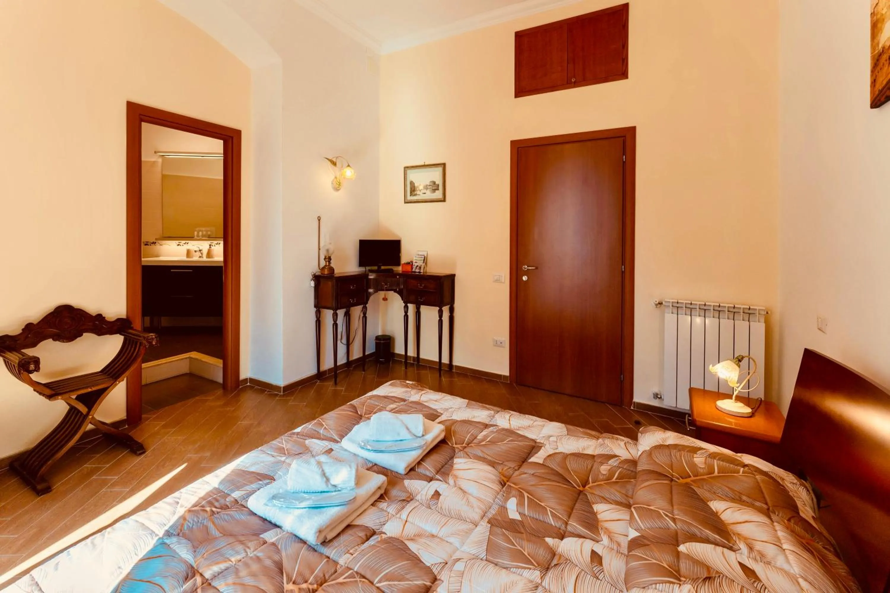 Bed in MICLAD Colosseum Guest House