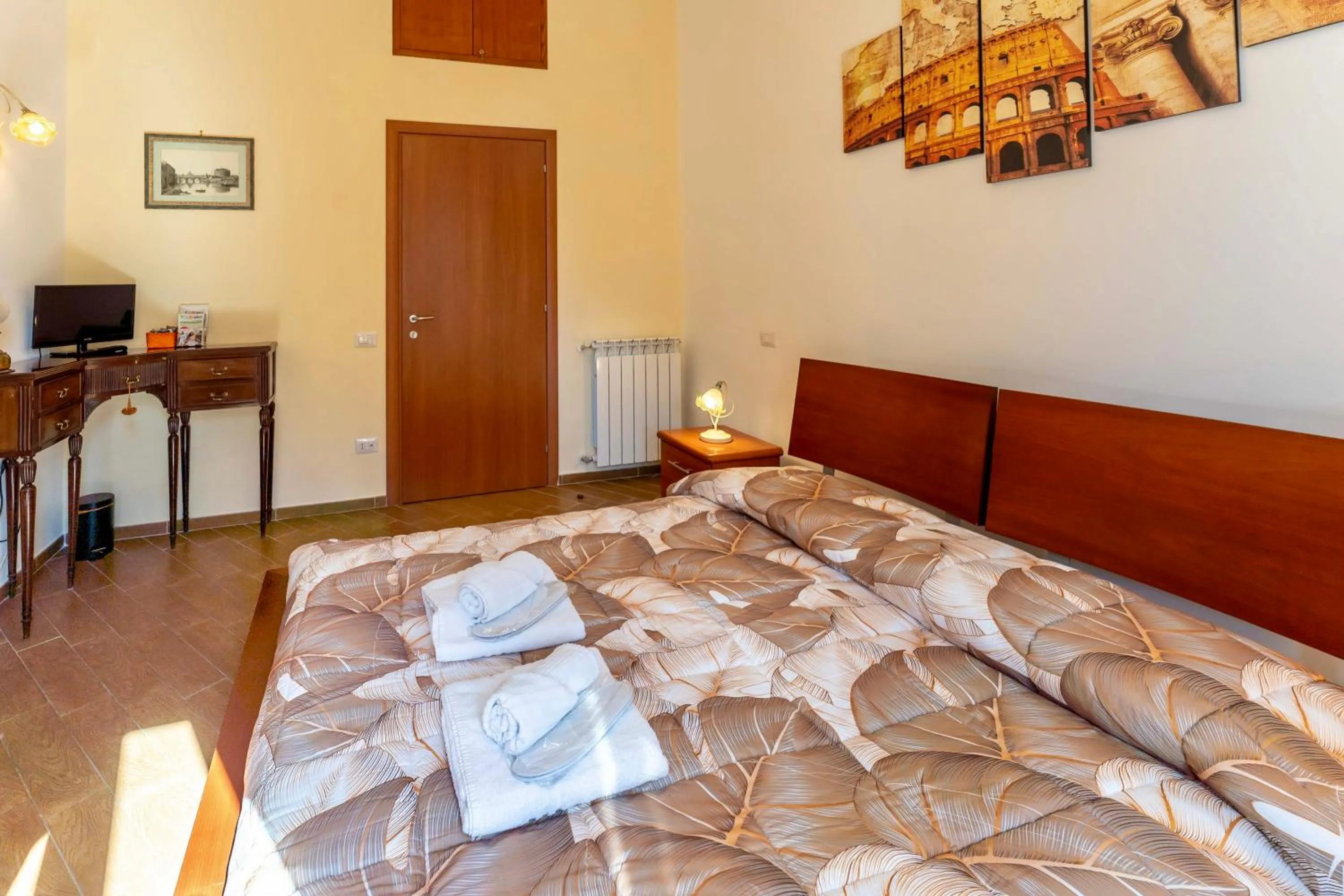 Bed in MICLAD Colosseum Guest House