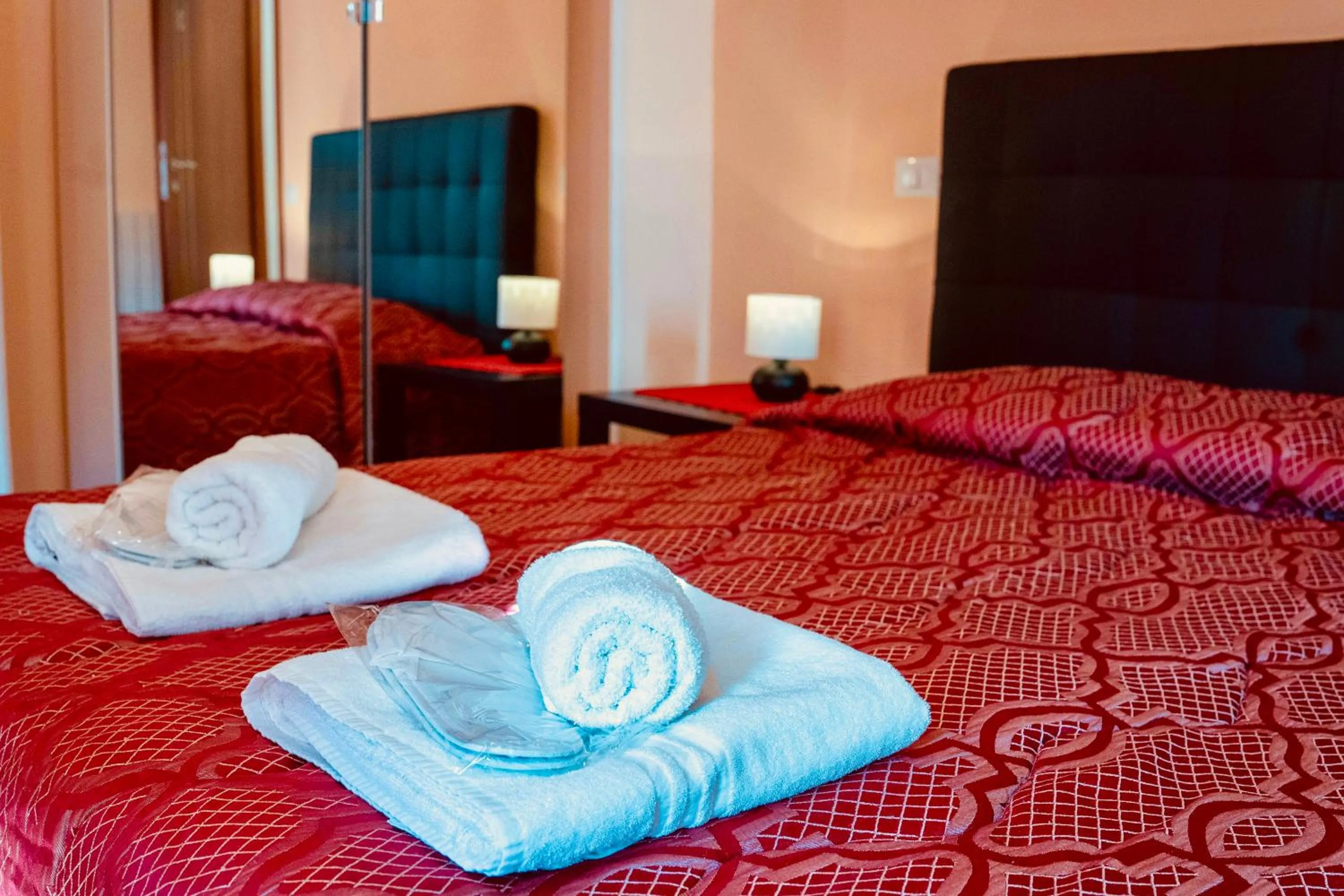 Bed in MICLAD Colosseum Guest House