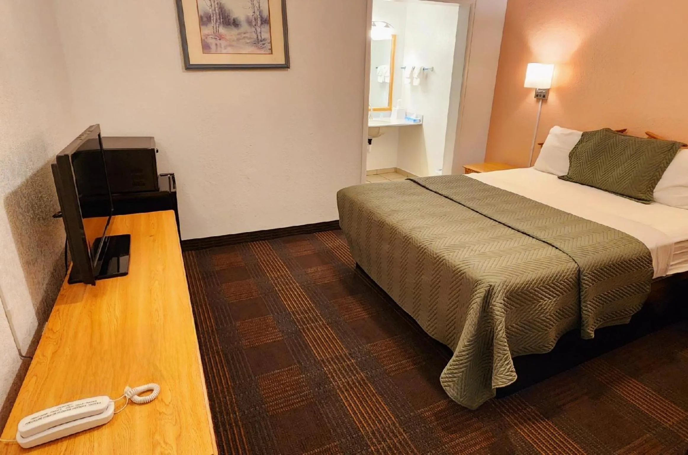 Bed in Silver Saddle Motel