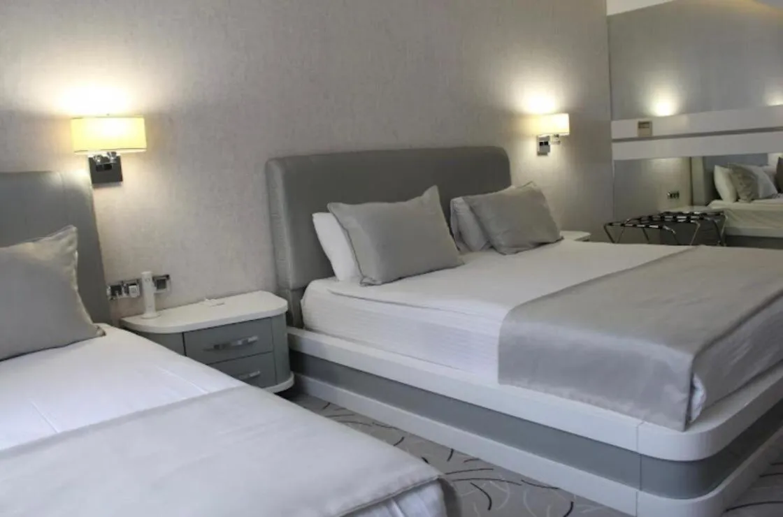 Bed in White Line Boutique Hotel