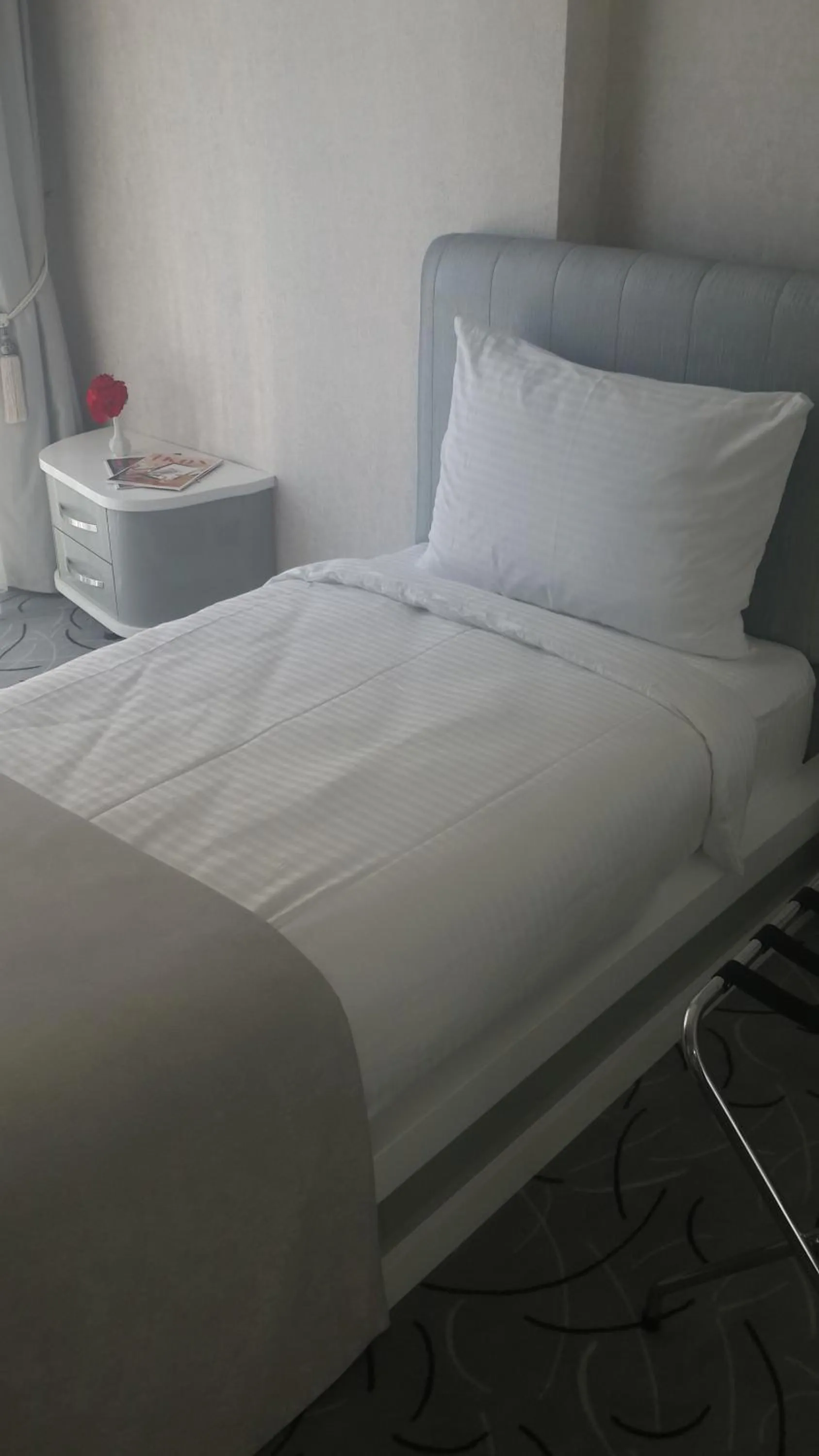 Decorative detail, Bed in White Line Boutique Hotel