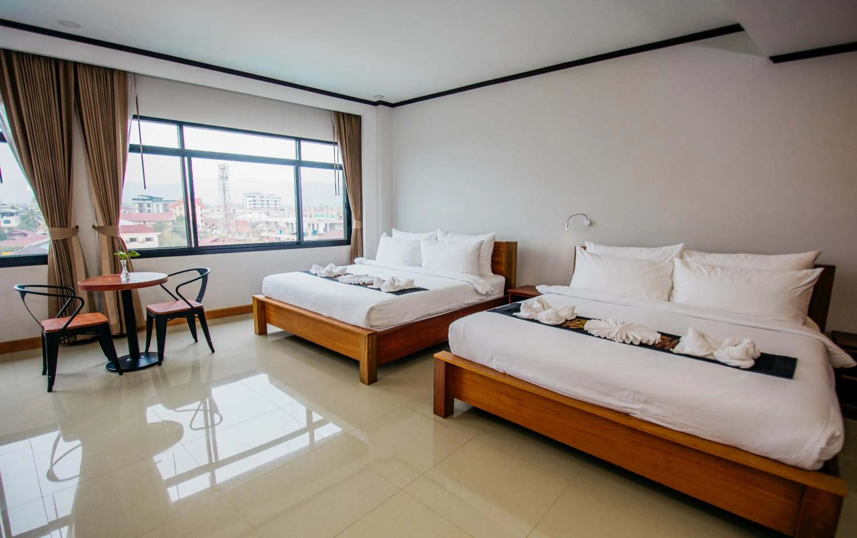 Bed in Sisombat Plaza Hotel