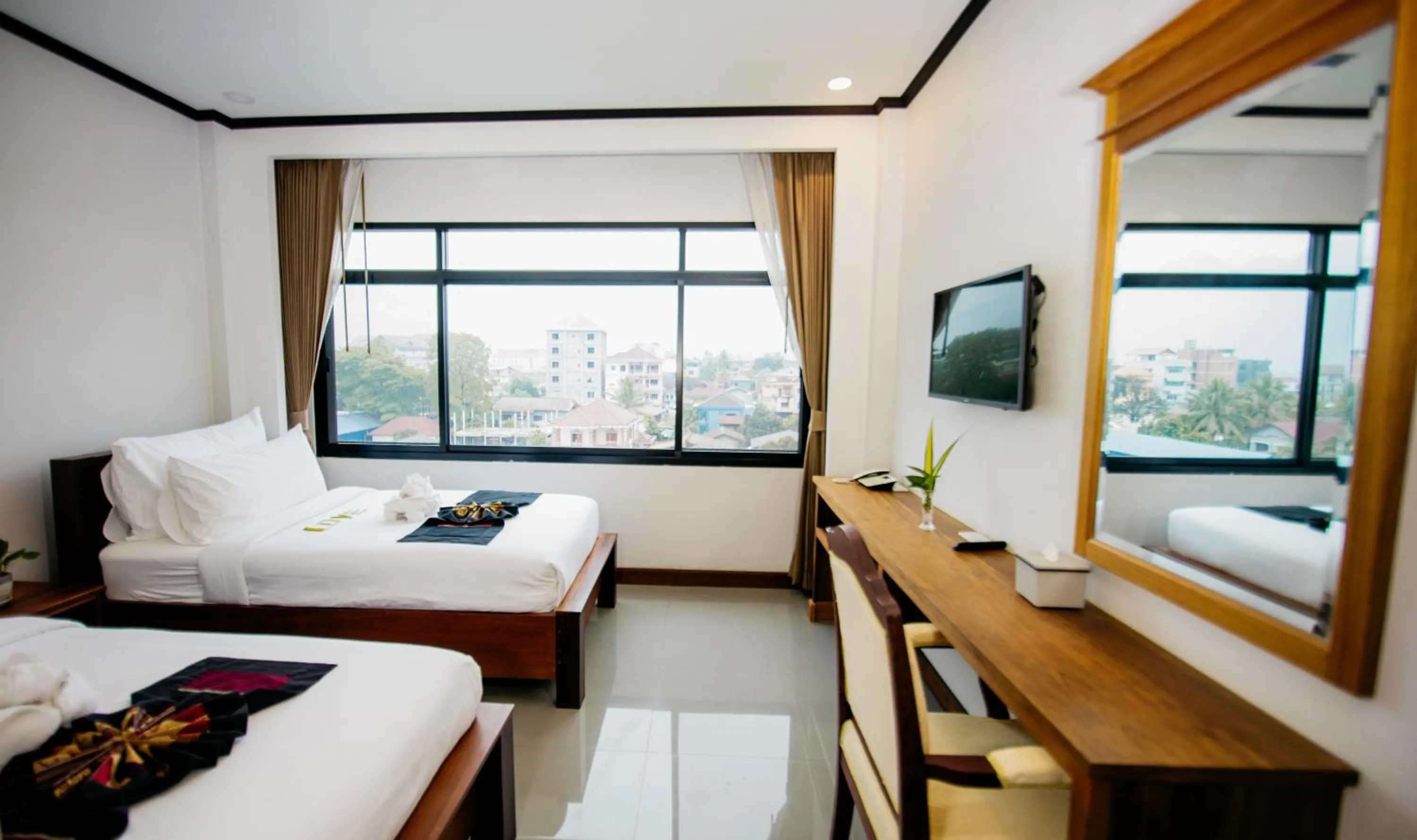 Photo of the whole room, Bed in Sisombat Plaza Hotel