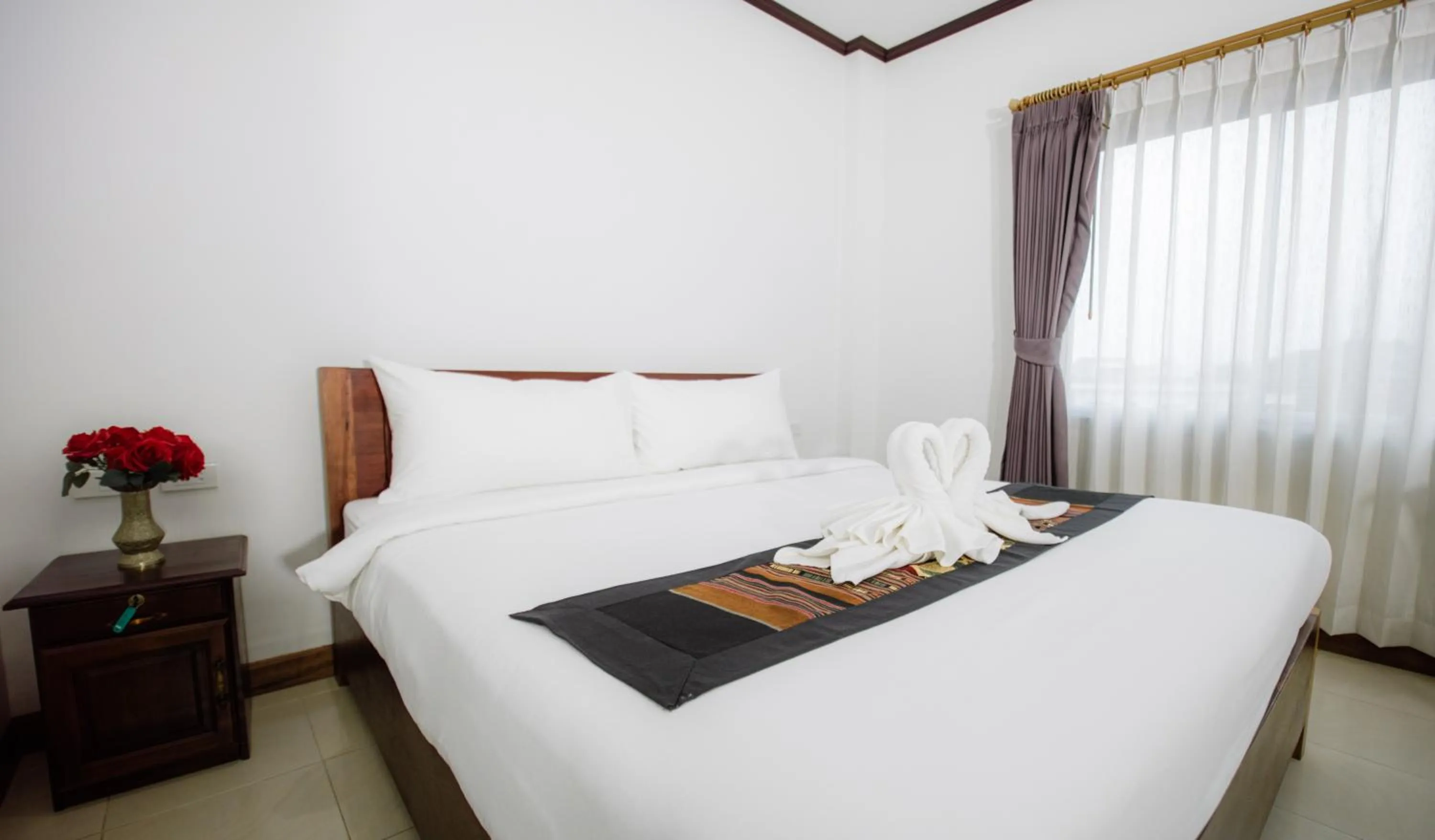 Bed in Sisombat Plaza Hotel