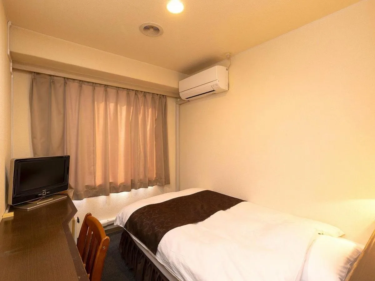 Bed in New Gloria Oita Hotel