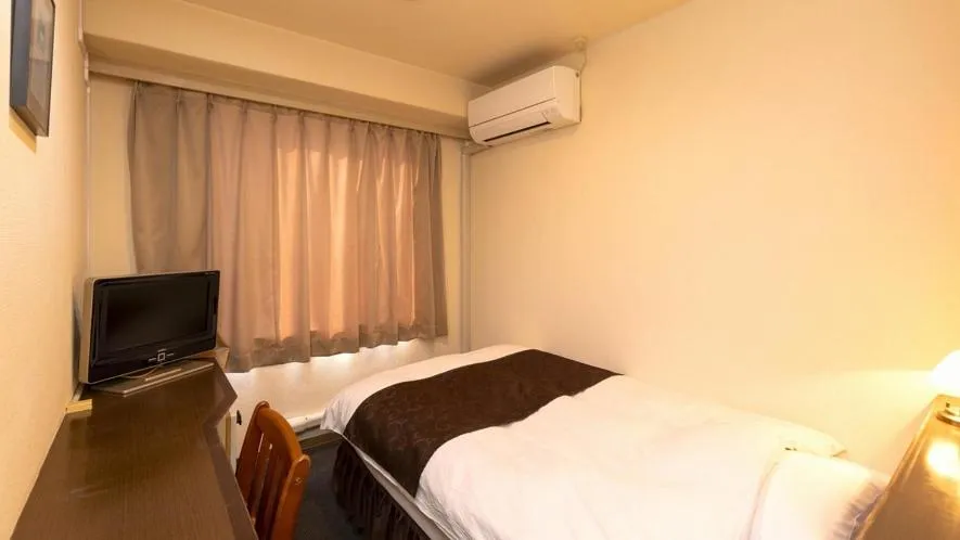 Bed in New Gloria Oita Hotel