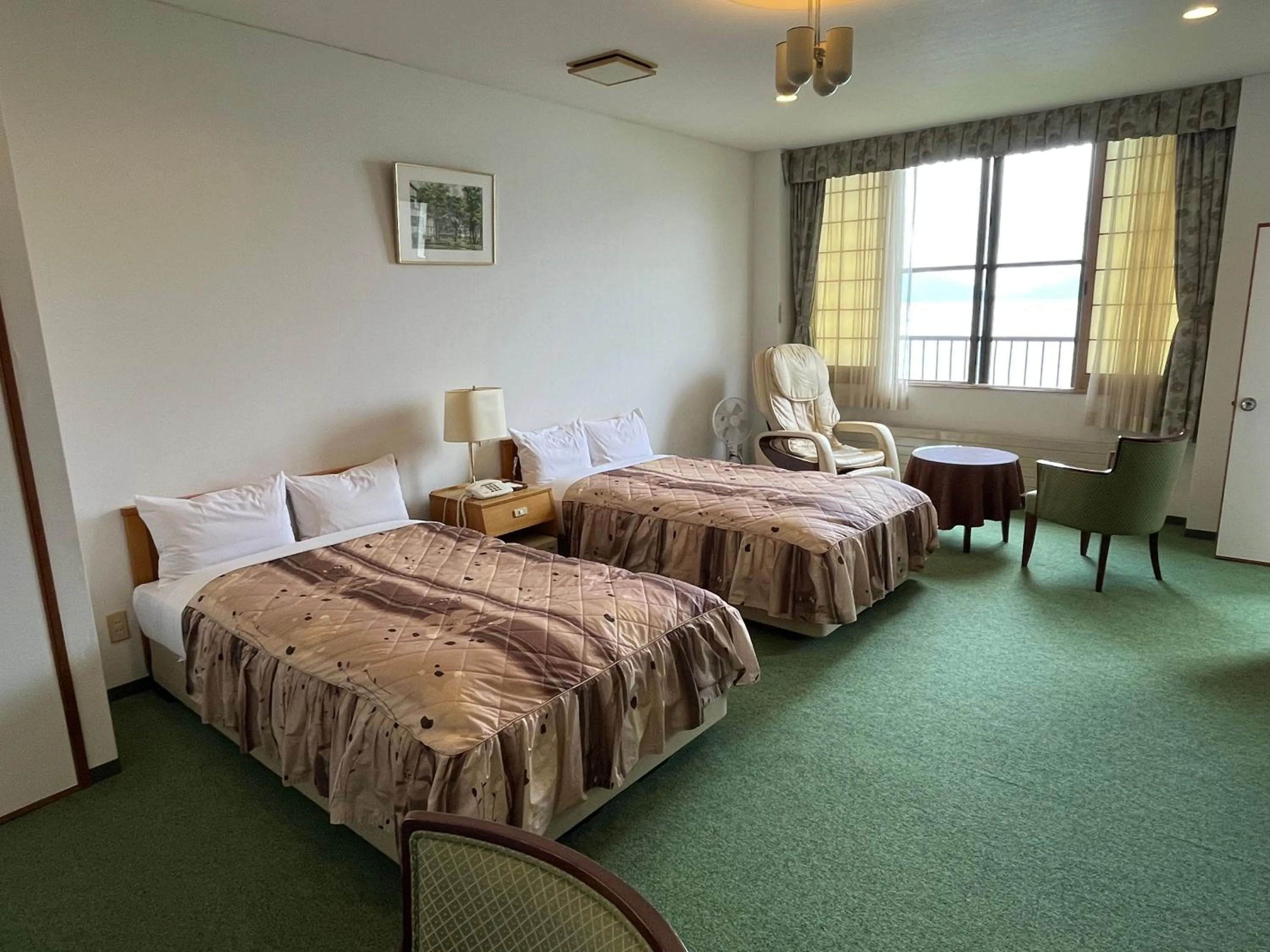 Seating area, Bed in Sapporo's Secret Onsen Sanctuary Marukoma Onsen Ryokan