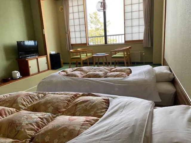 Bed in Sapporo's Secret Onsen Sanctuary Marukoma Onsen Ryokan