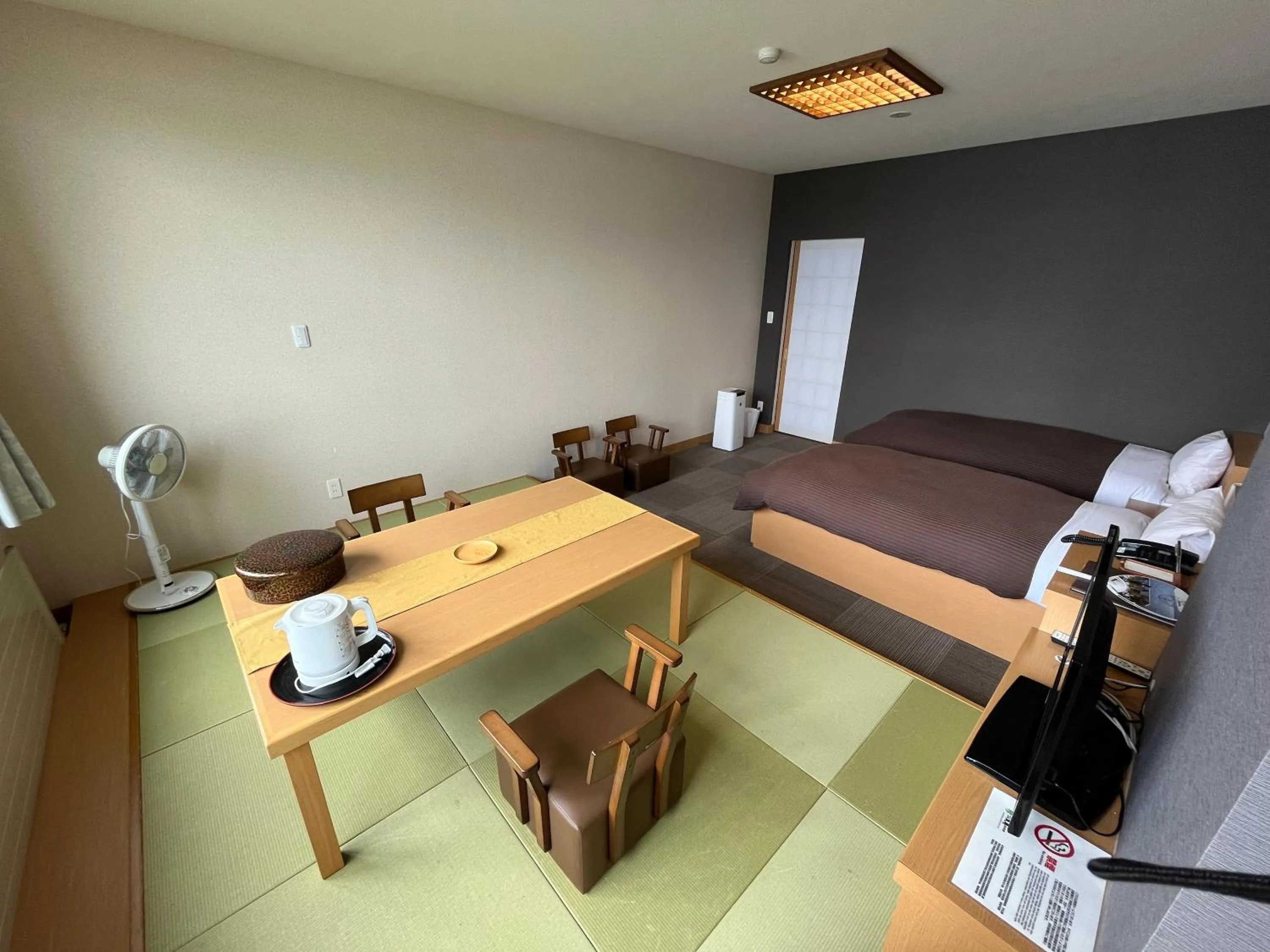 Seating area, Bed in Sapporo's Secret Onsen Sanctuary Marukoma Onsen Ryokan