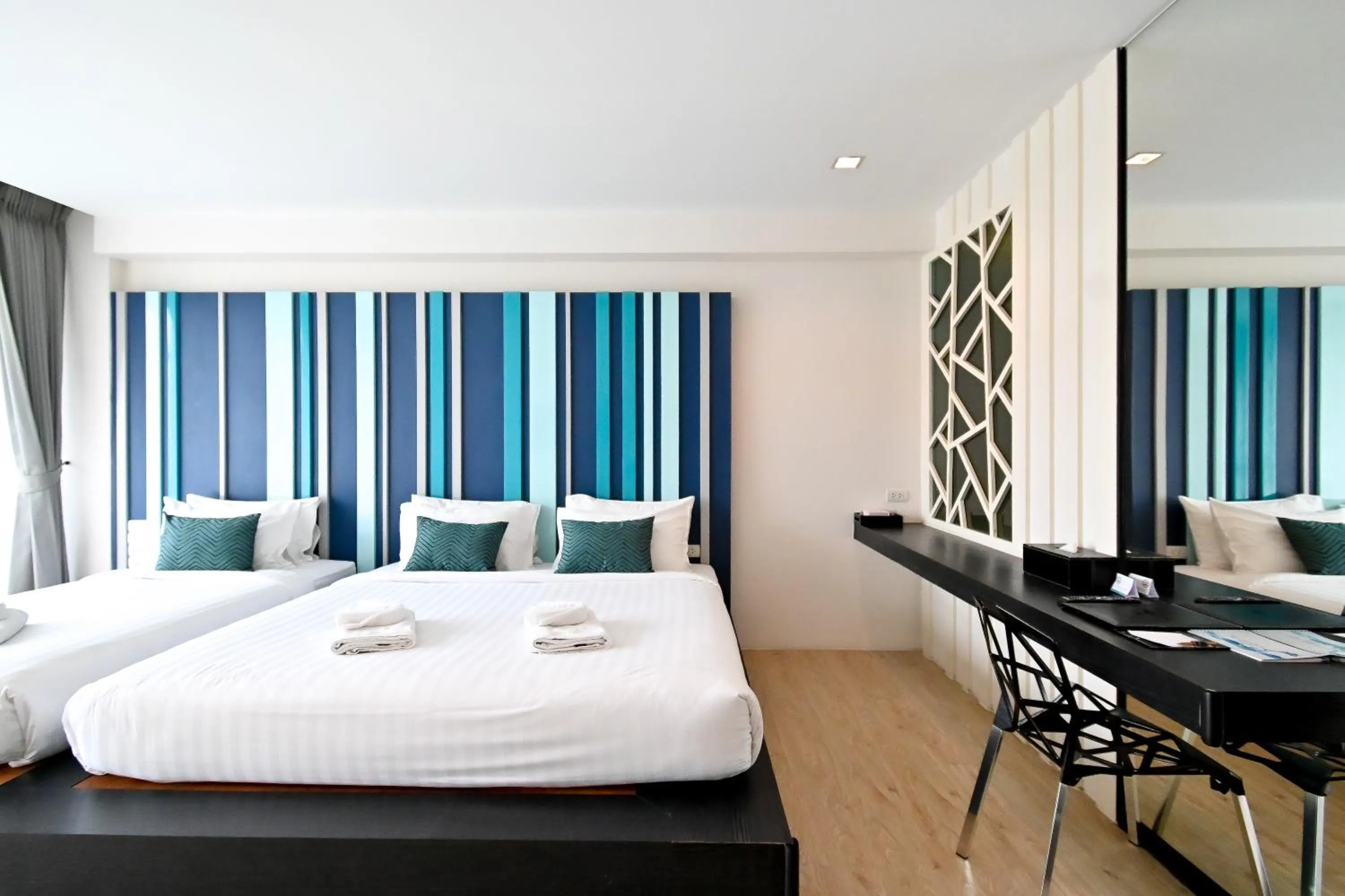 Bed in @T Boutique Hotel