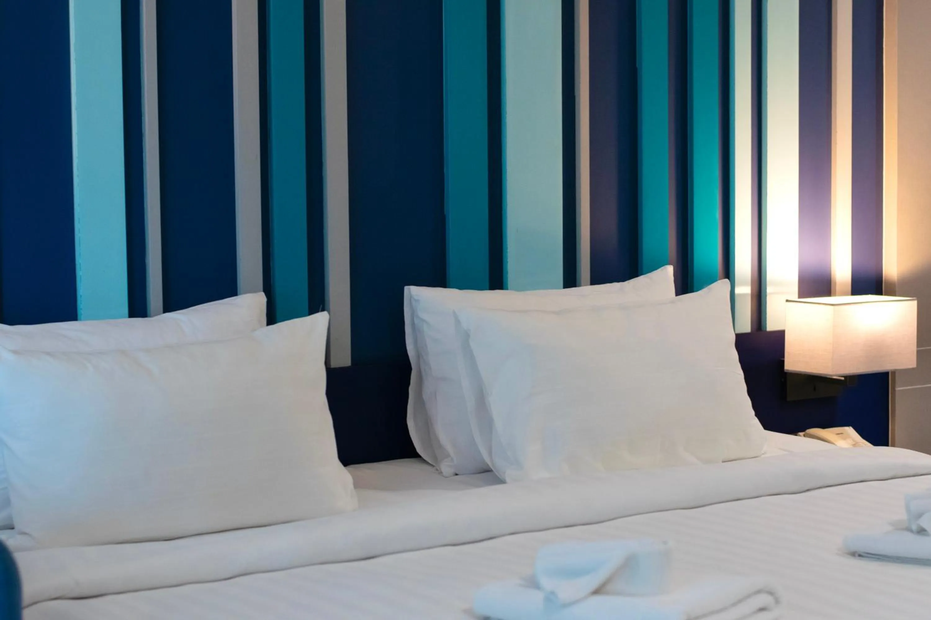 Bed in @T Boutique Hotel