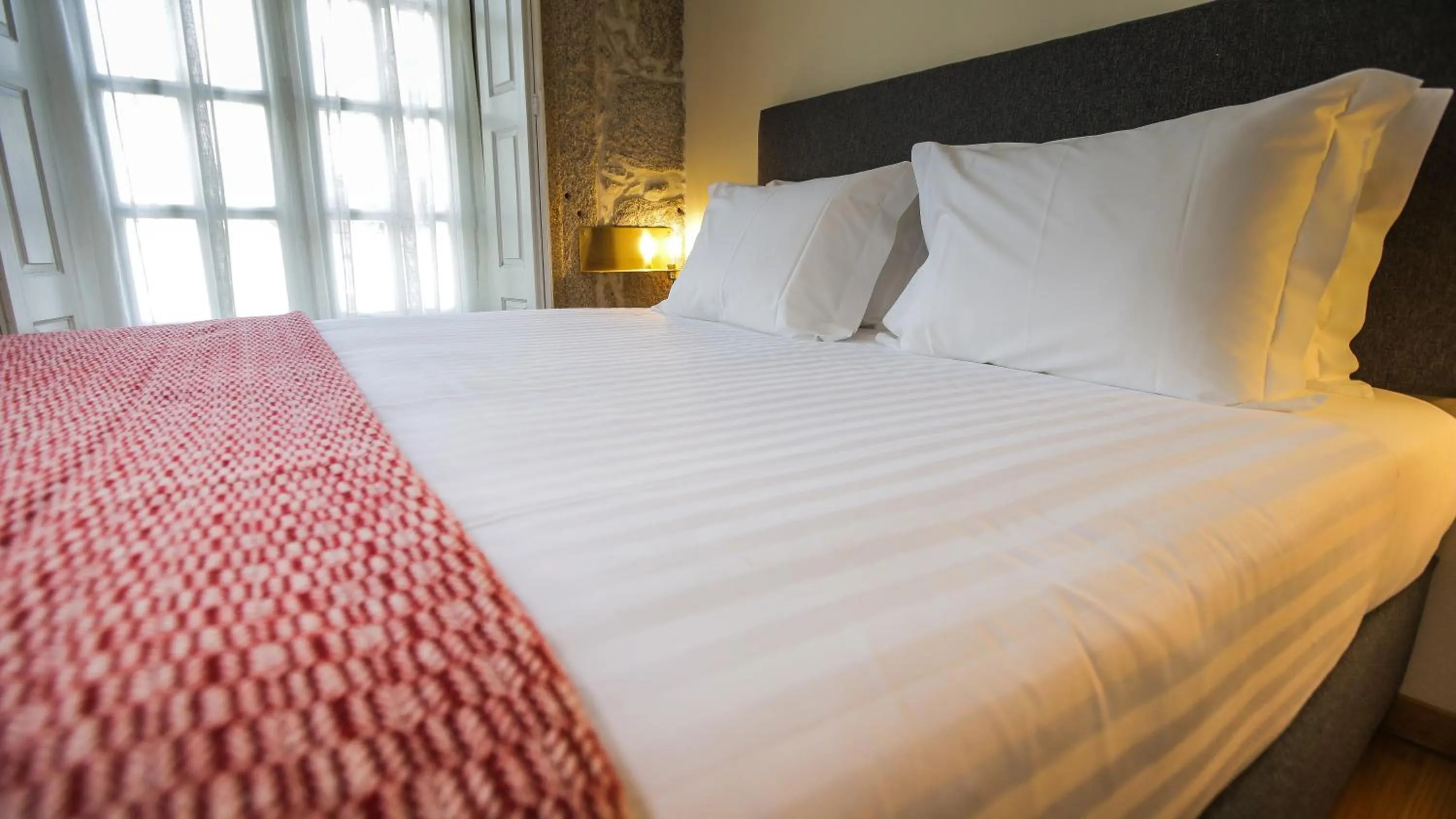 Bed in My Ribeira Guest House